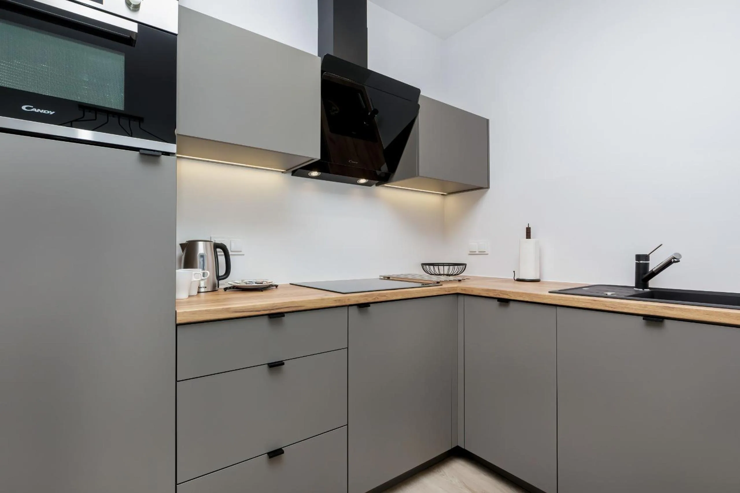 Kitchen or kitchenette in Modern City Center Apartments by Noclegi Renters