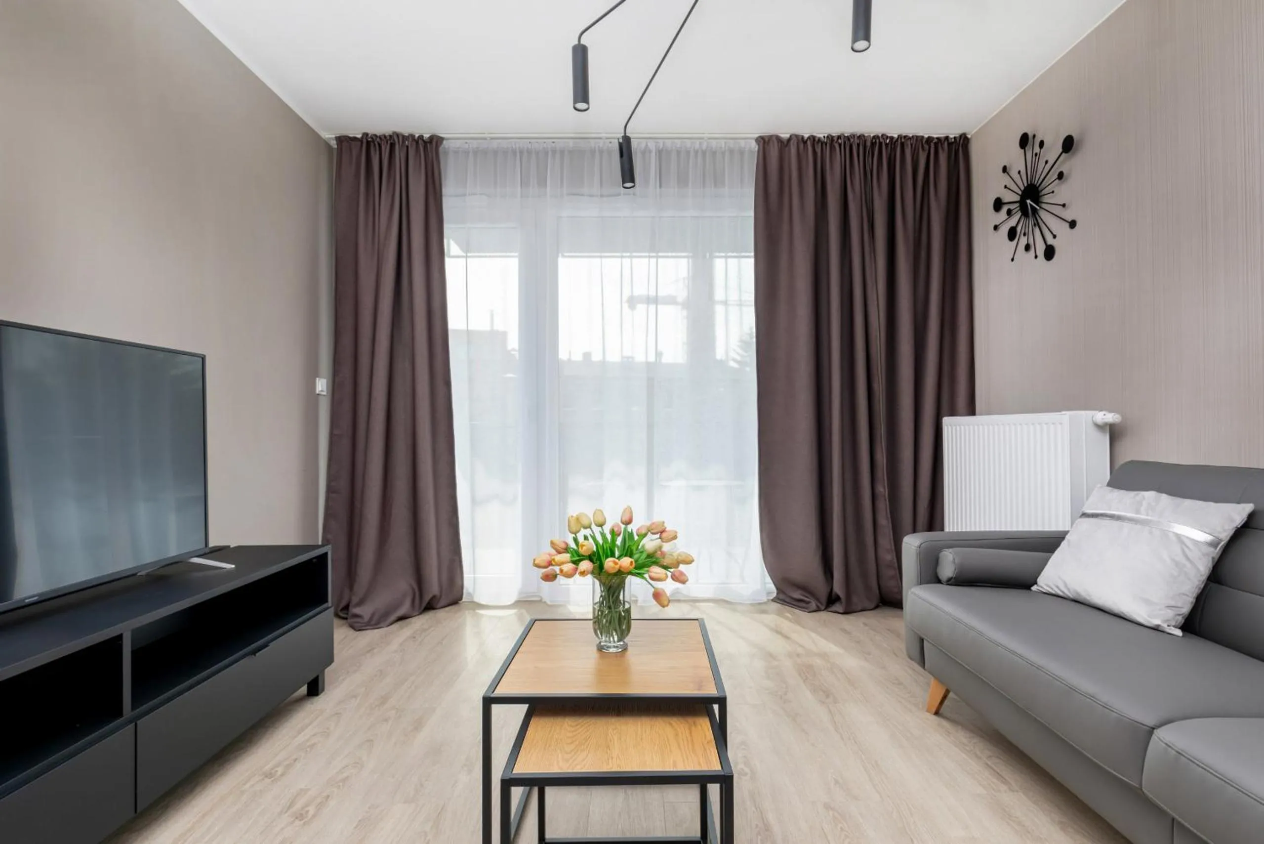 Living room in Modern City Center Apartments by Noclegi Renters