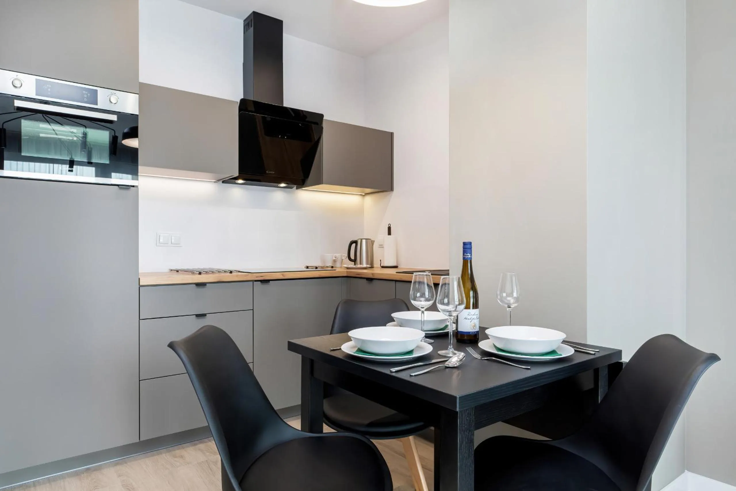 Kitchen or kitchenette in Modern City Center Apartments by Noclegi Renters