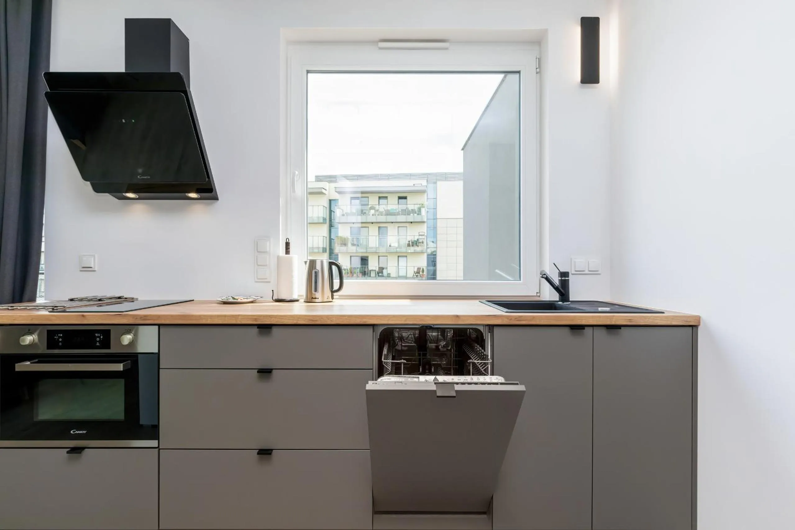 Kitchen or kitchenette in Modern City Center Apartments by Noclegi Renters