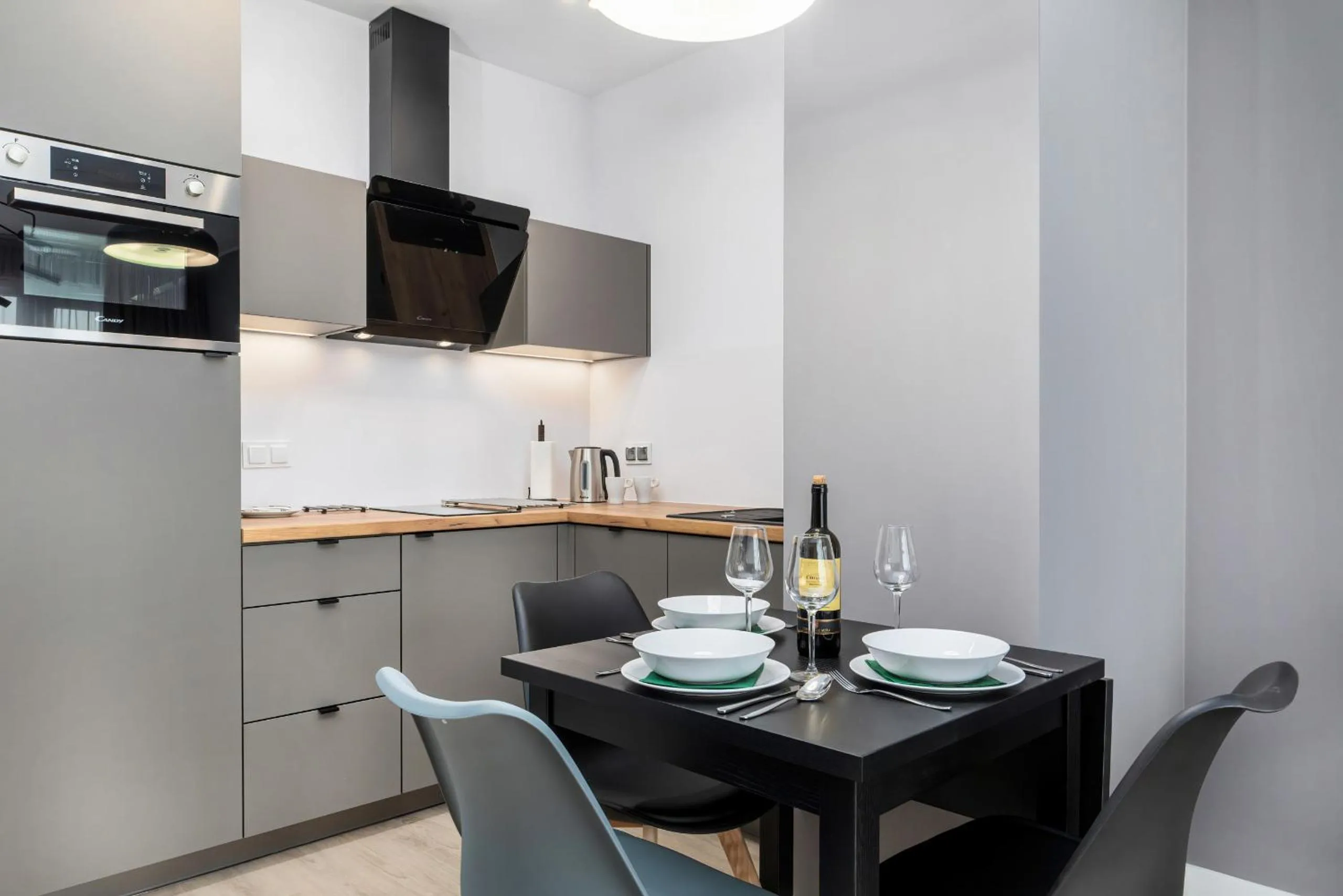 Kitchen or kitchenette in Modern City Center Apartments by Noclegi Renters