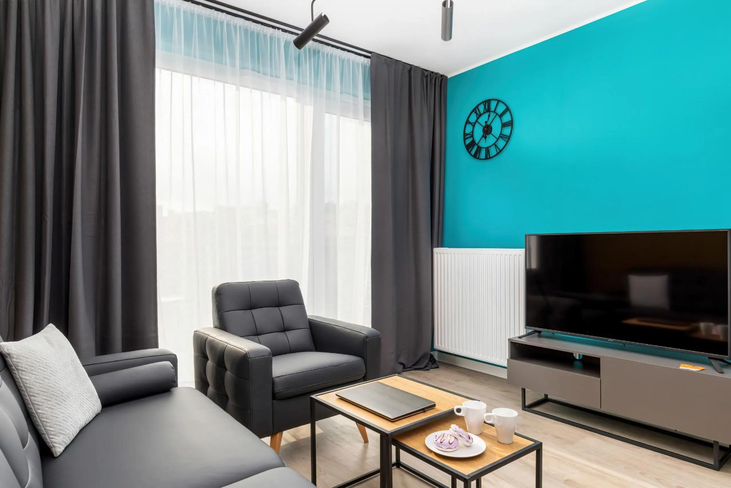 Living room in Modern City Center Apartments by Noclegi Renters