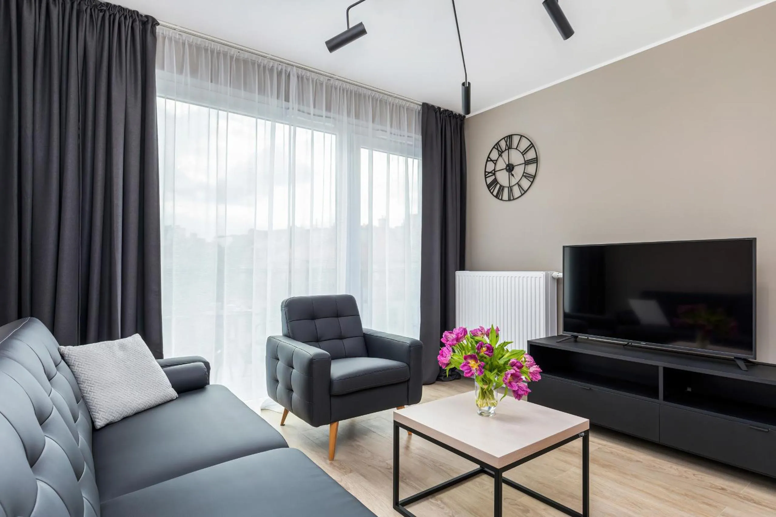Living room in Modern City Center Apartments by Noclegi Renters