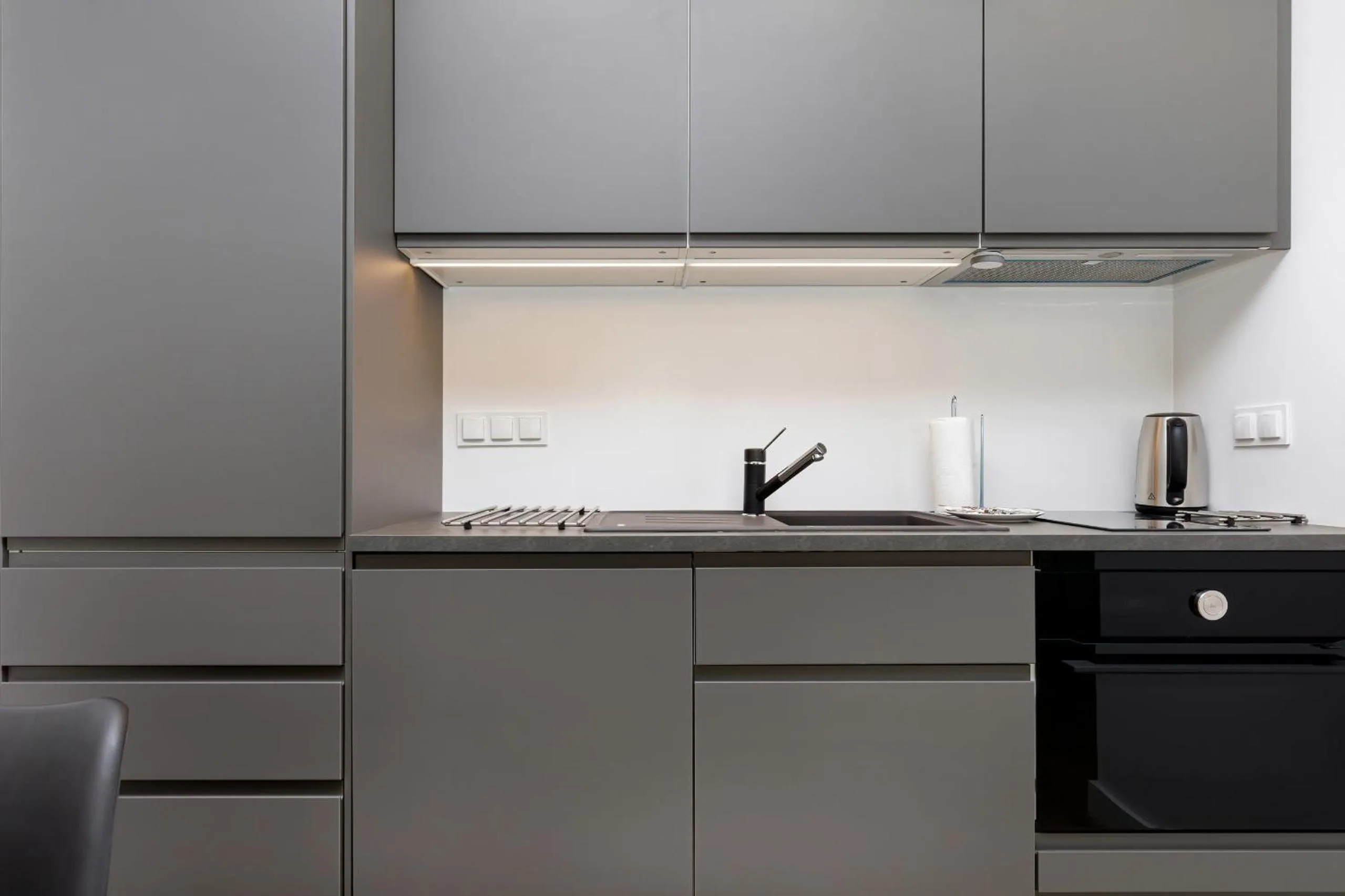Kitchen or kitchenette in Modern City Center Apartments by Noclegi Renters