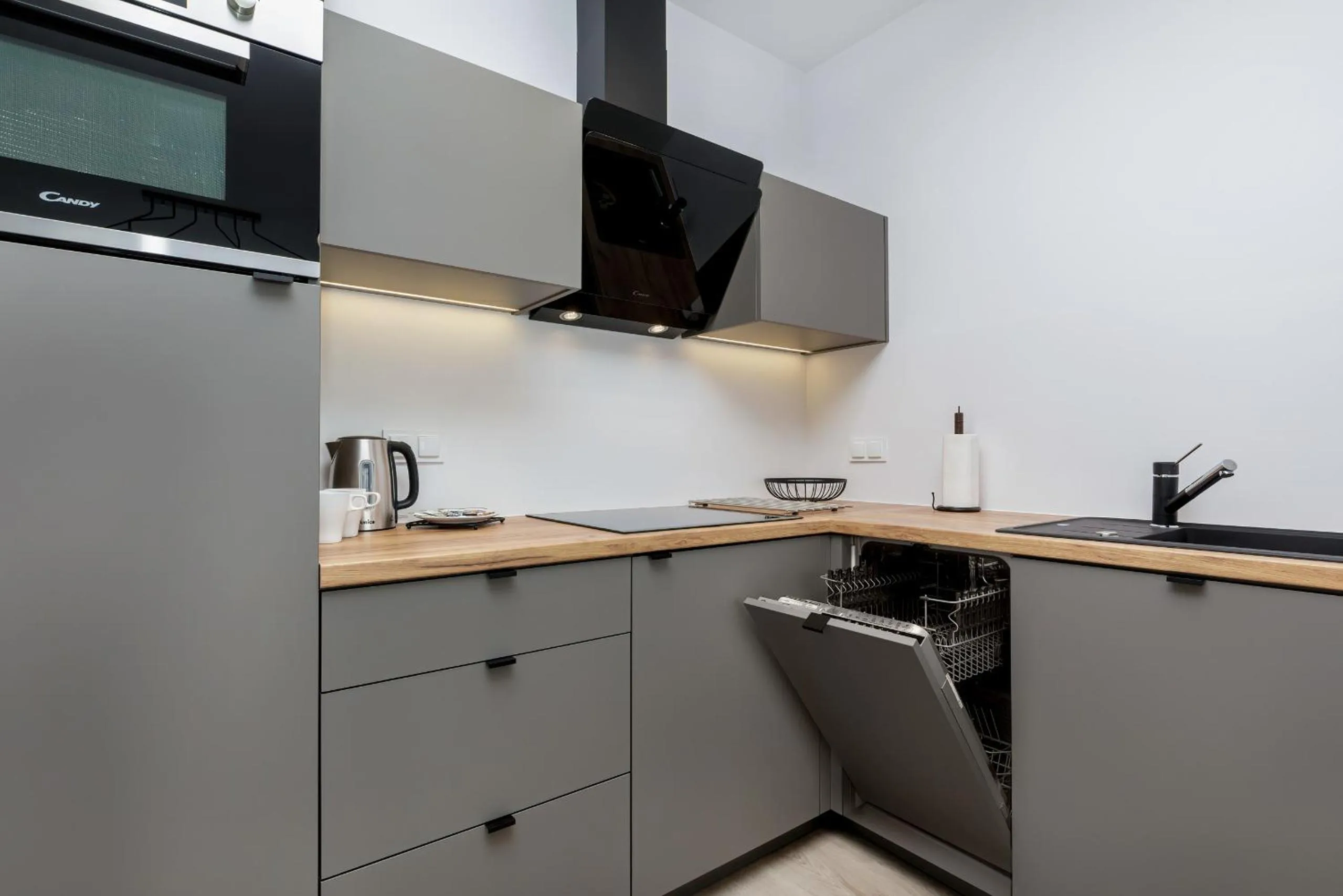 Kitchen or kitchenette in Modern City Center Apartments by Noclegi Renters