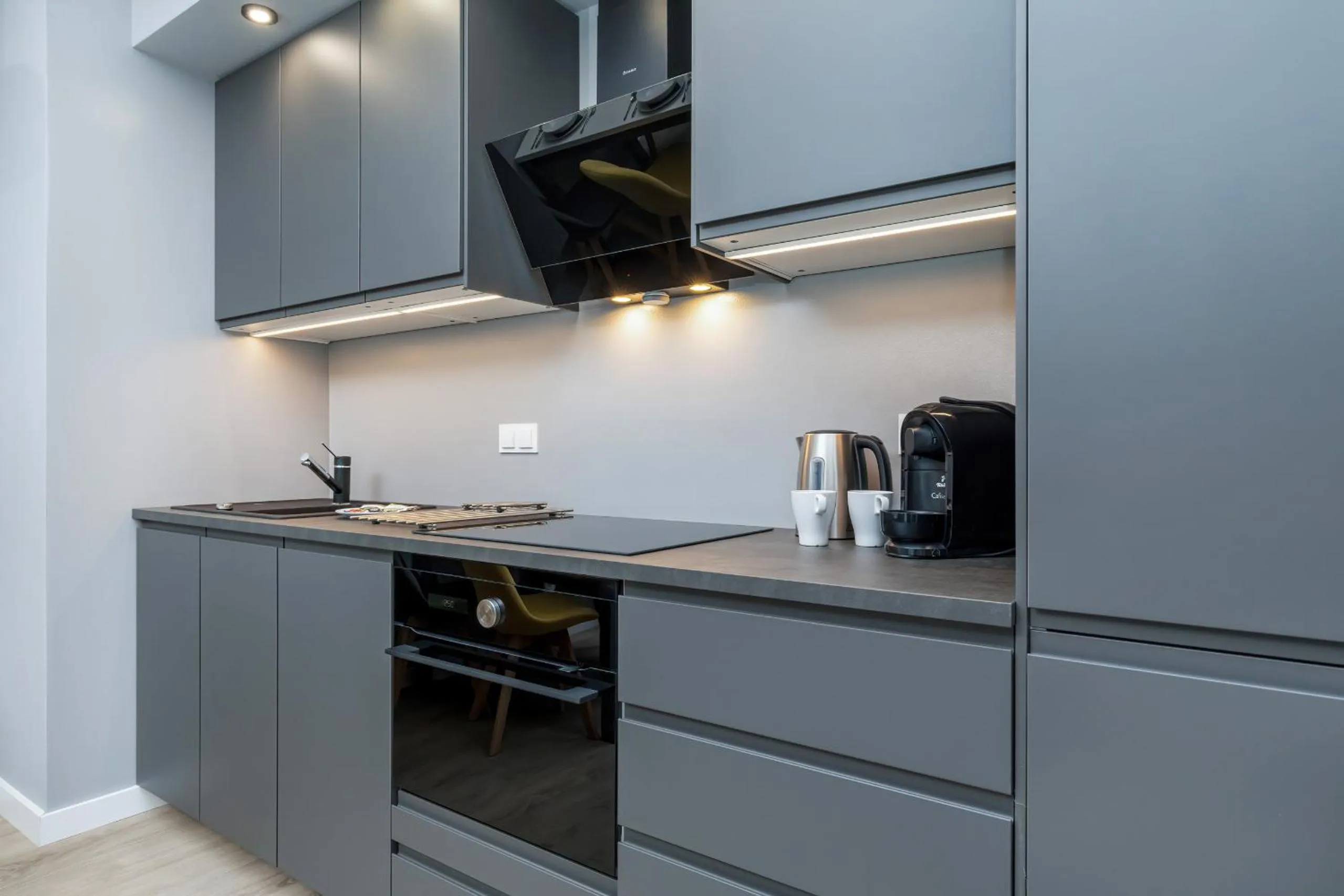 Kitchen or kitchenette in Modern City Center Apartments by Noclegi Renters