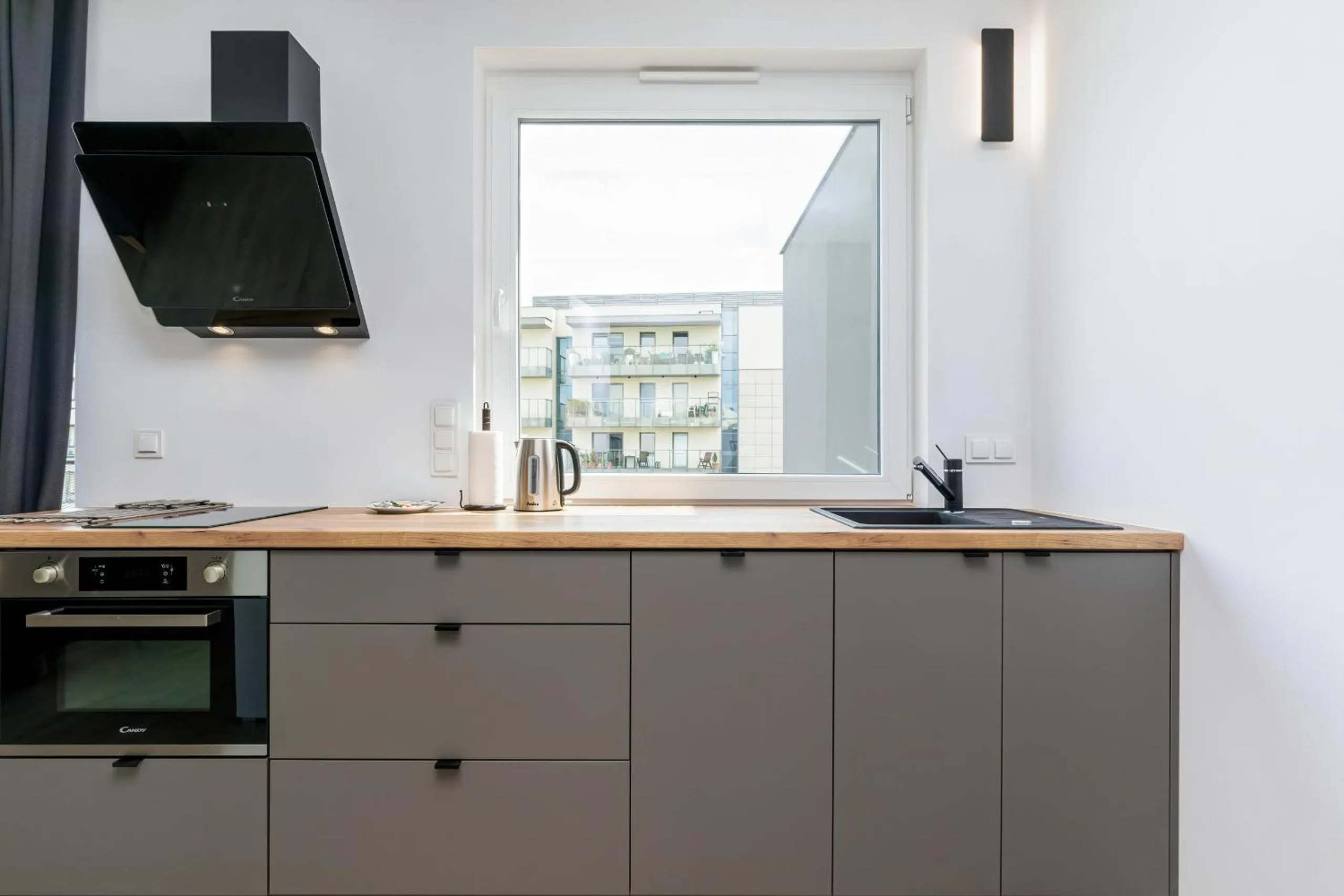 Kitchen or kitchenette in Modern City Center Apartments by Noclegi Renters