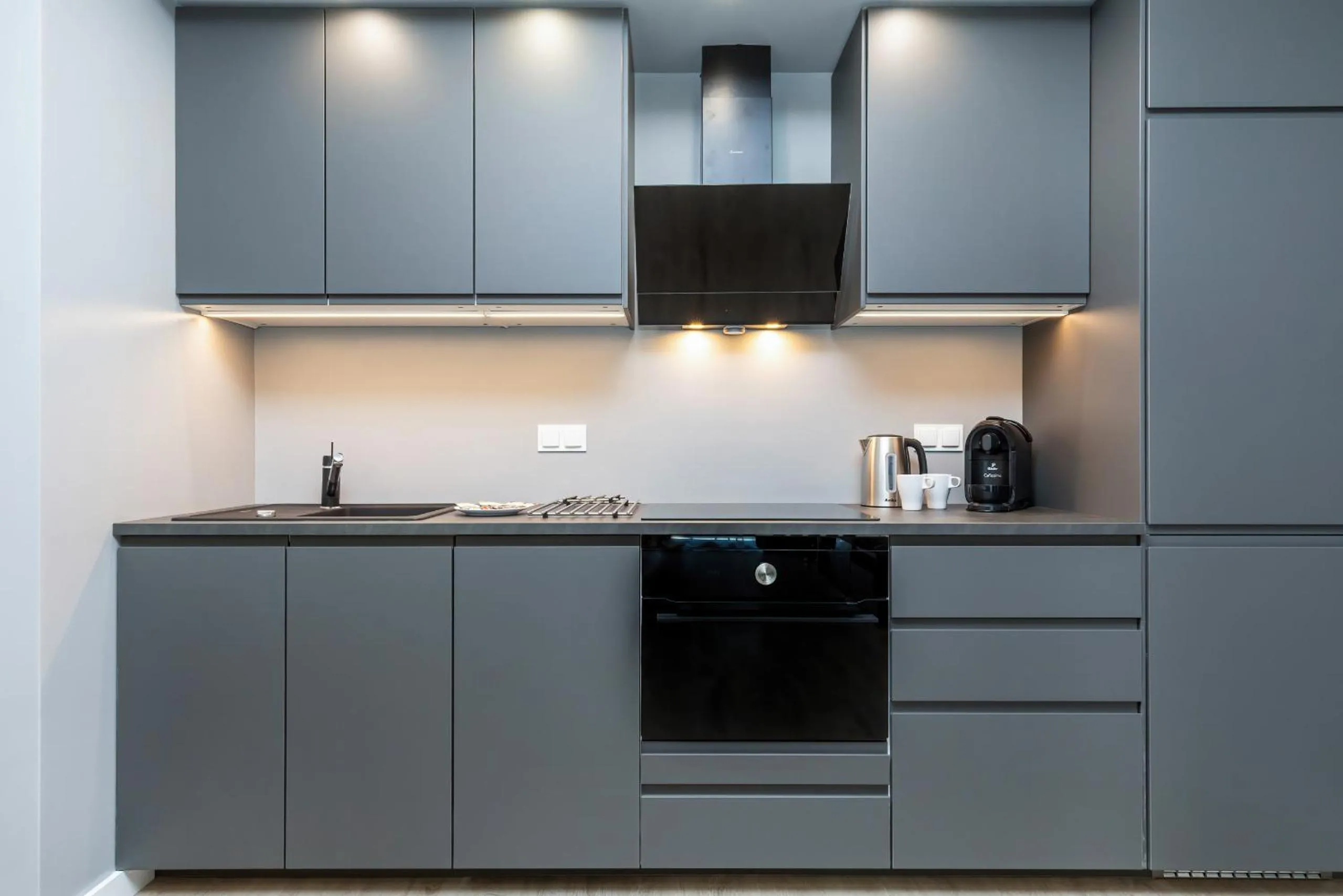 Kitchen or kitchenette in Modern City Center Apartments by Noclegi Renters