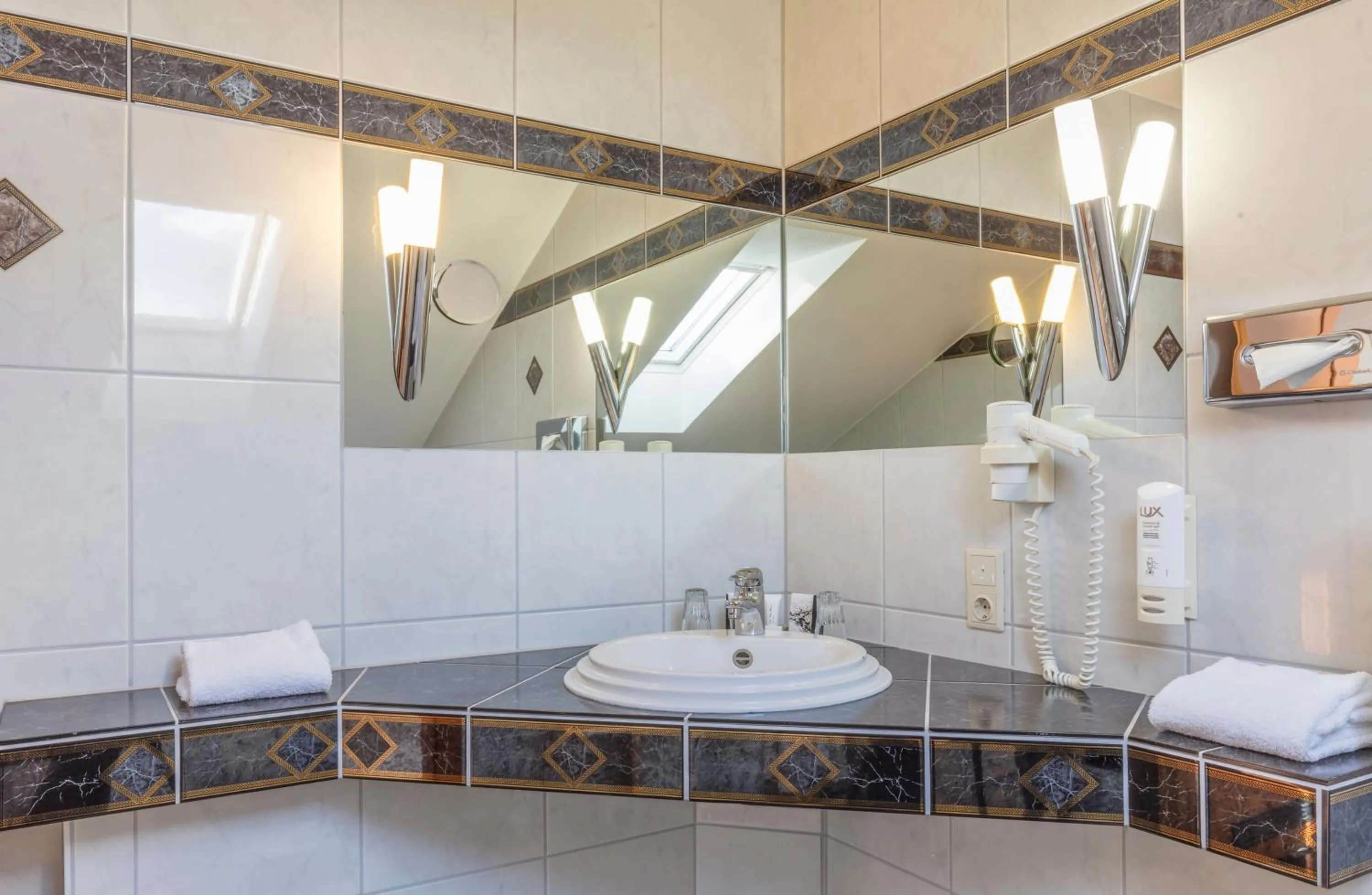 Bathroom in Sport- und Tagungshotel De Poort