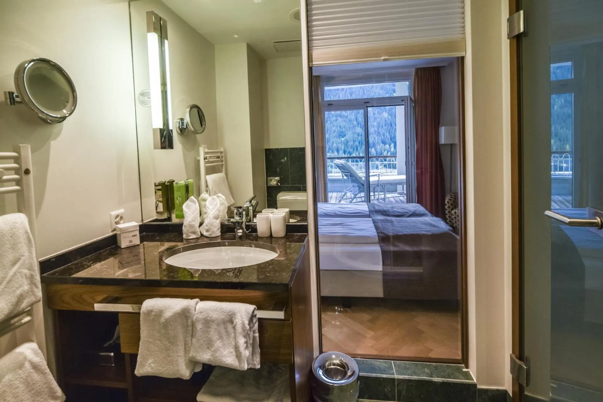 Bathroom, Bed in Waldhotel & SPA Davos - for body & soul