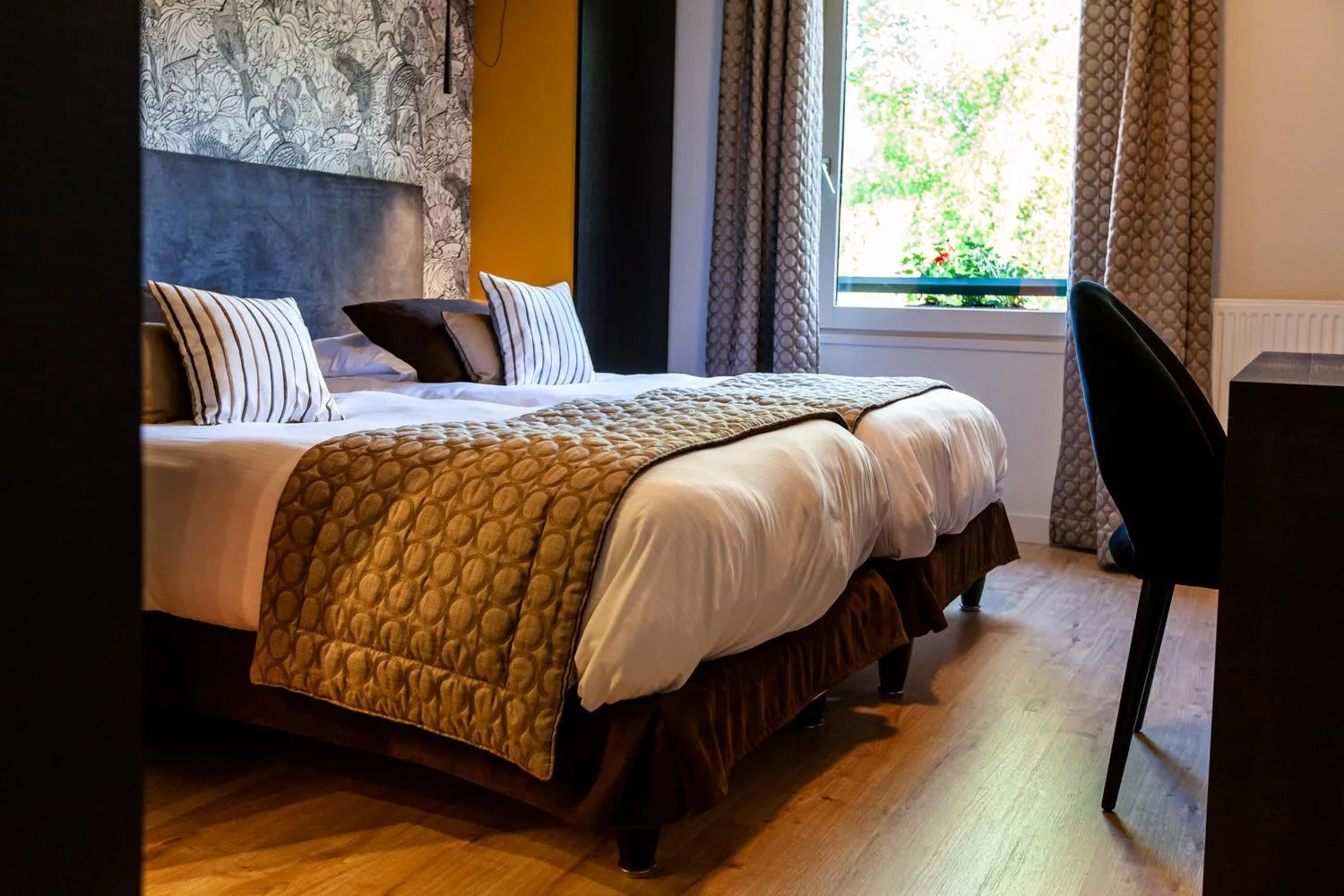 Bed in Logis Hotel Restaurant La Tour