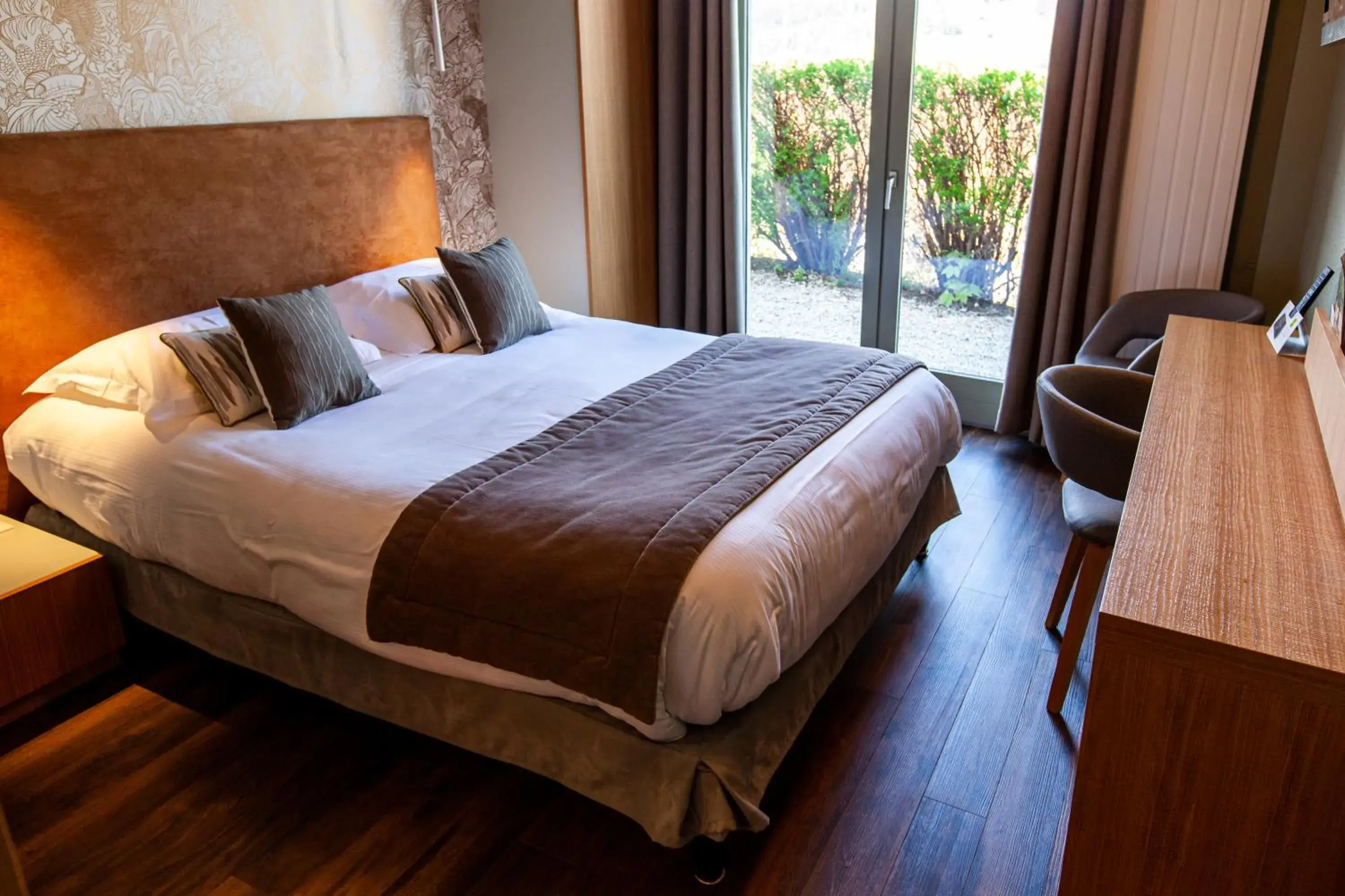 Bed in Logis Hotel Restaurant La Tour Bed in Logis Hotel Restaurant La Tour