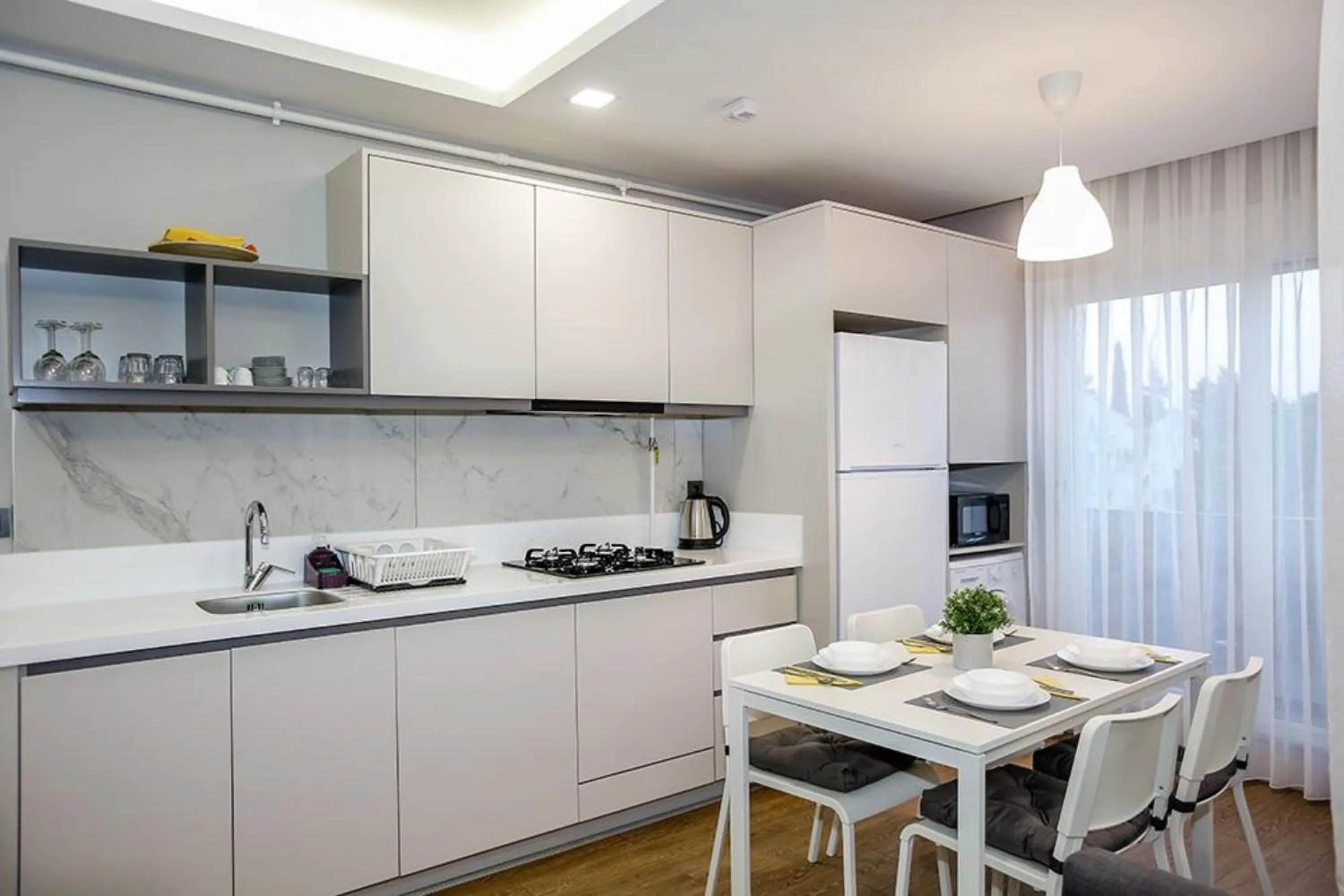 Kitchen or kitchenette in Stile Suite Family Hotel