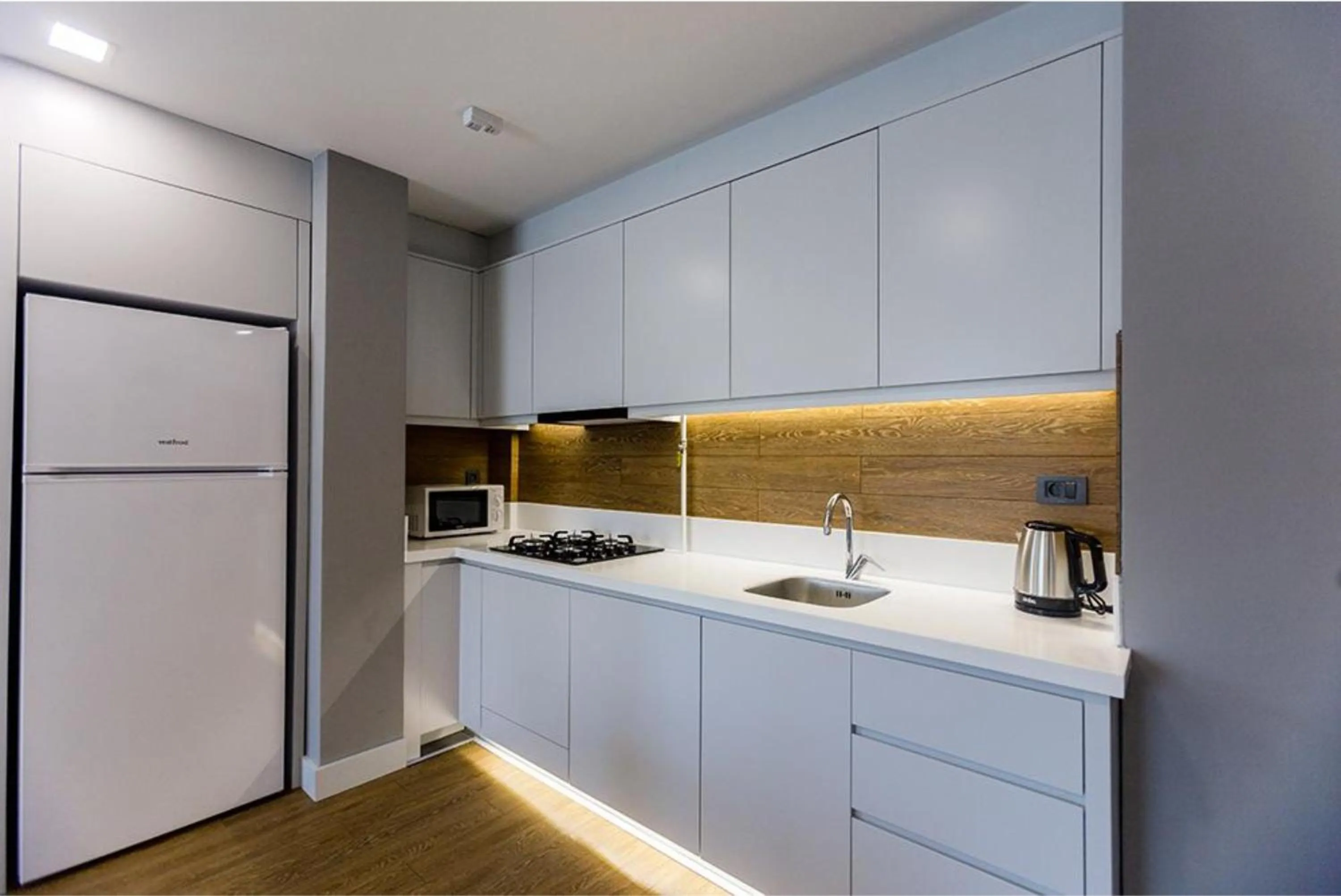 Kitchen or kitchenette in Stile Suite Family Hotel