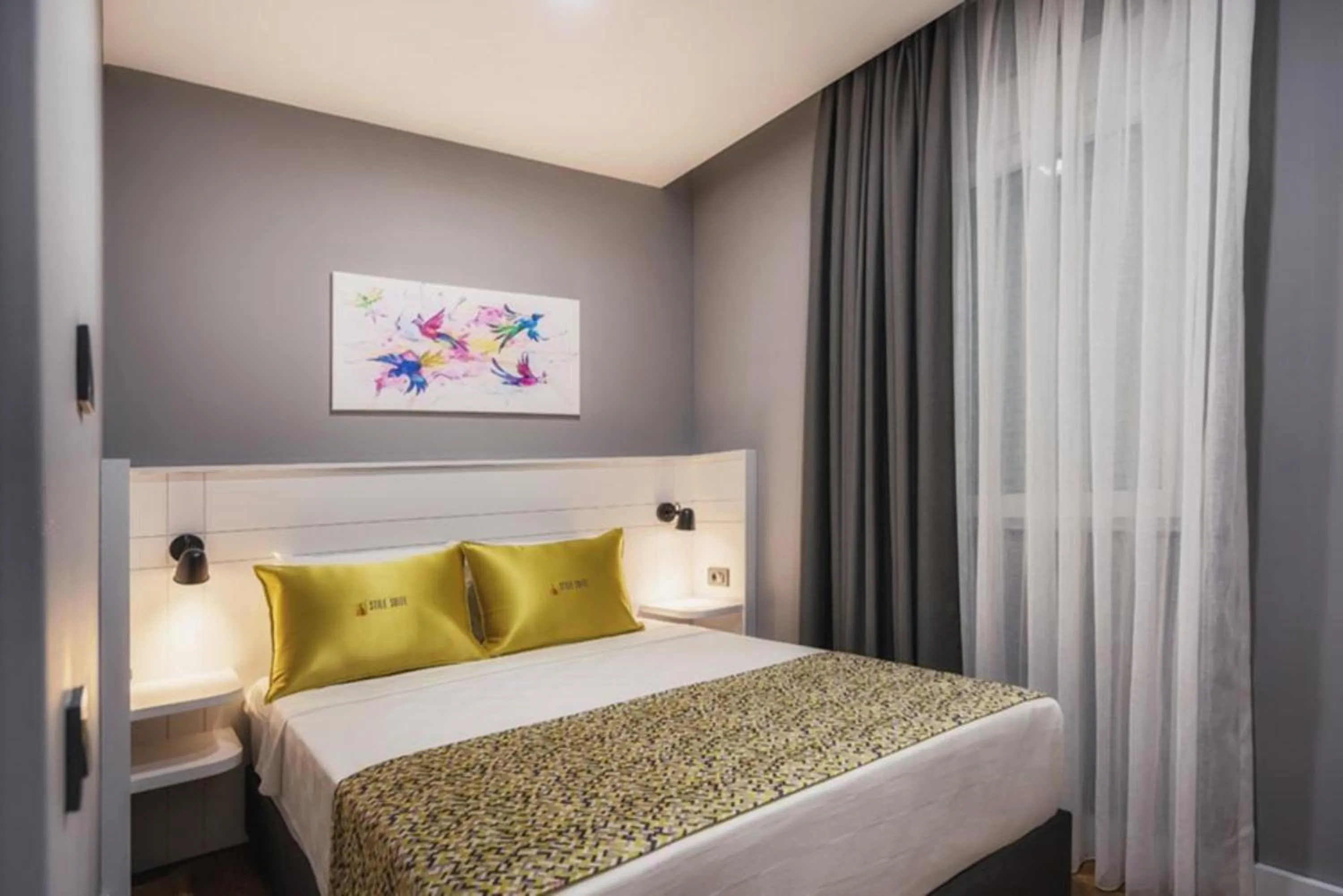 Bed in Stile Suite Family Hotel