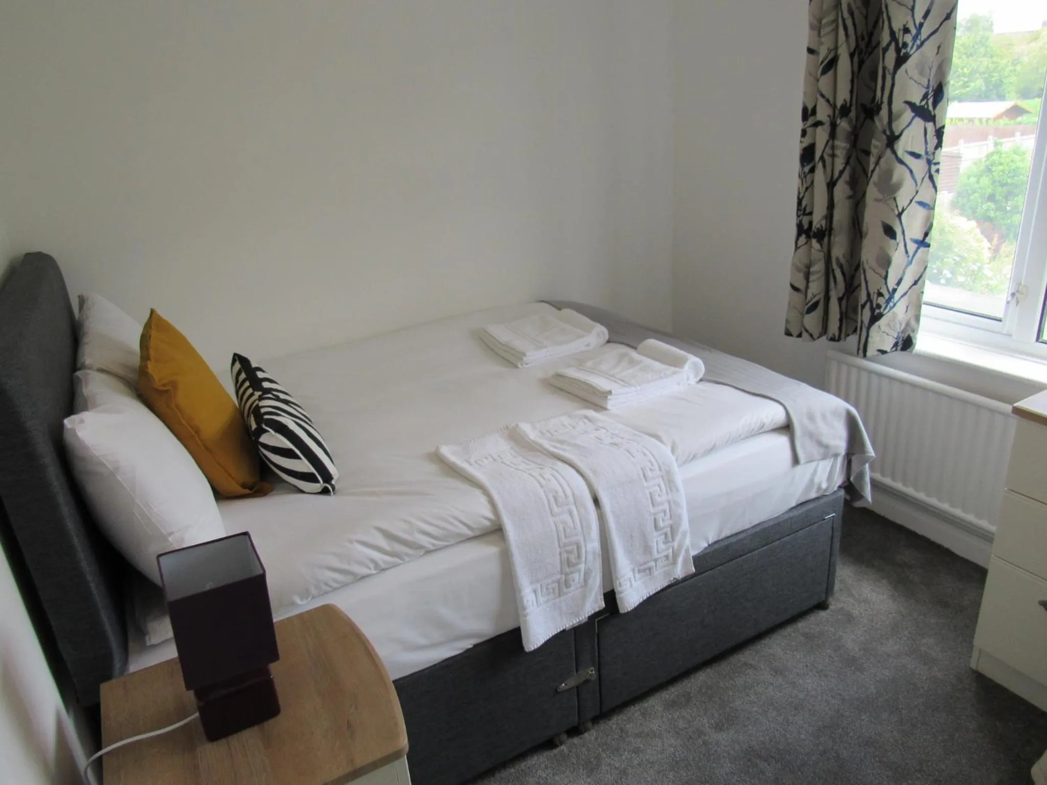 Bed in The Cambridge Suites - Tas Accommodations