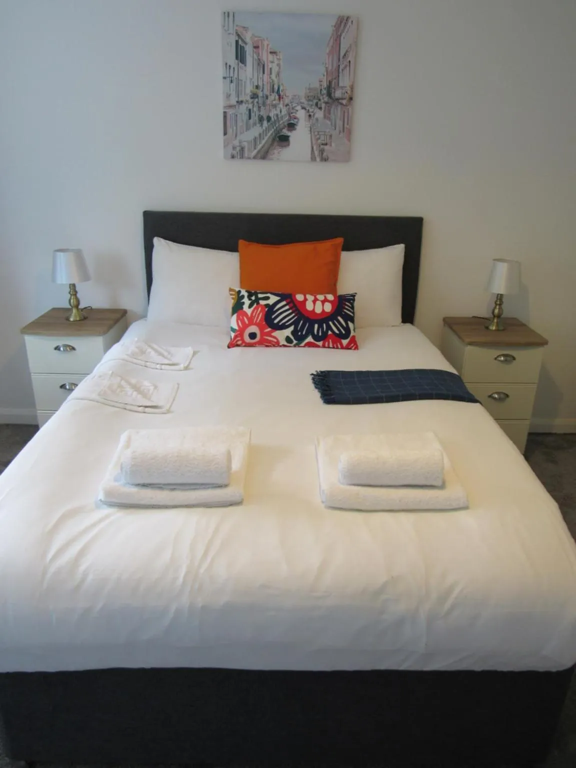 Bed in The Cambridge Suites - Tas Accommodations