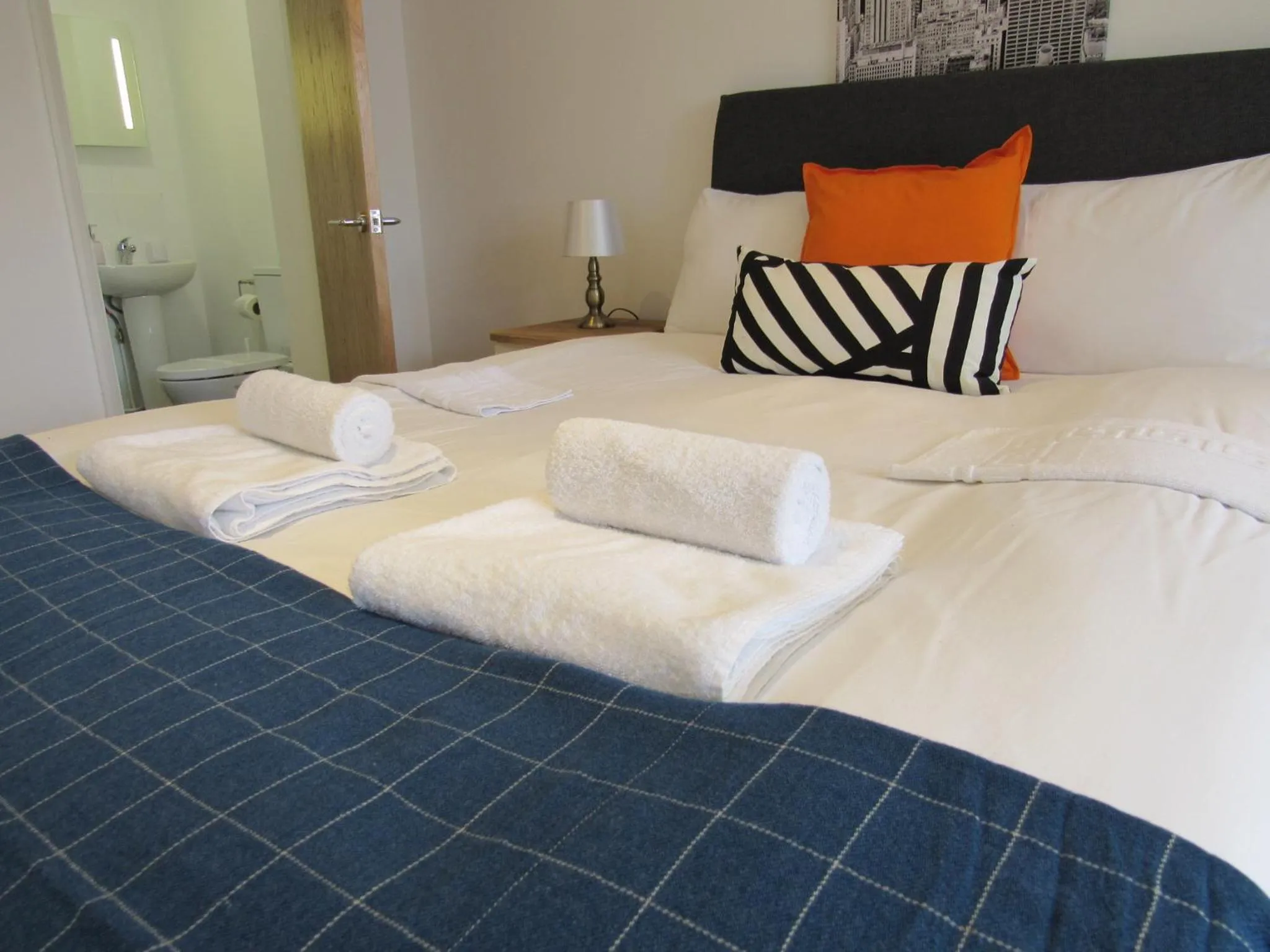 Bed in The Cambridge Suites - Tas Accommodations