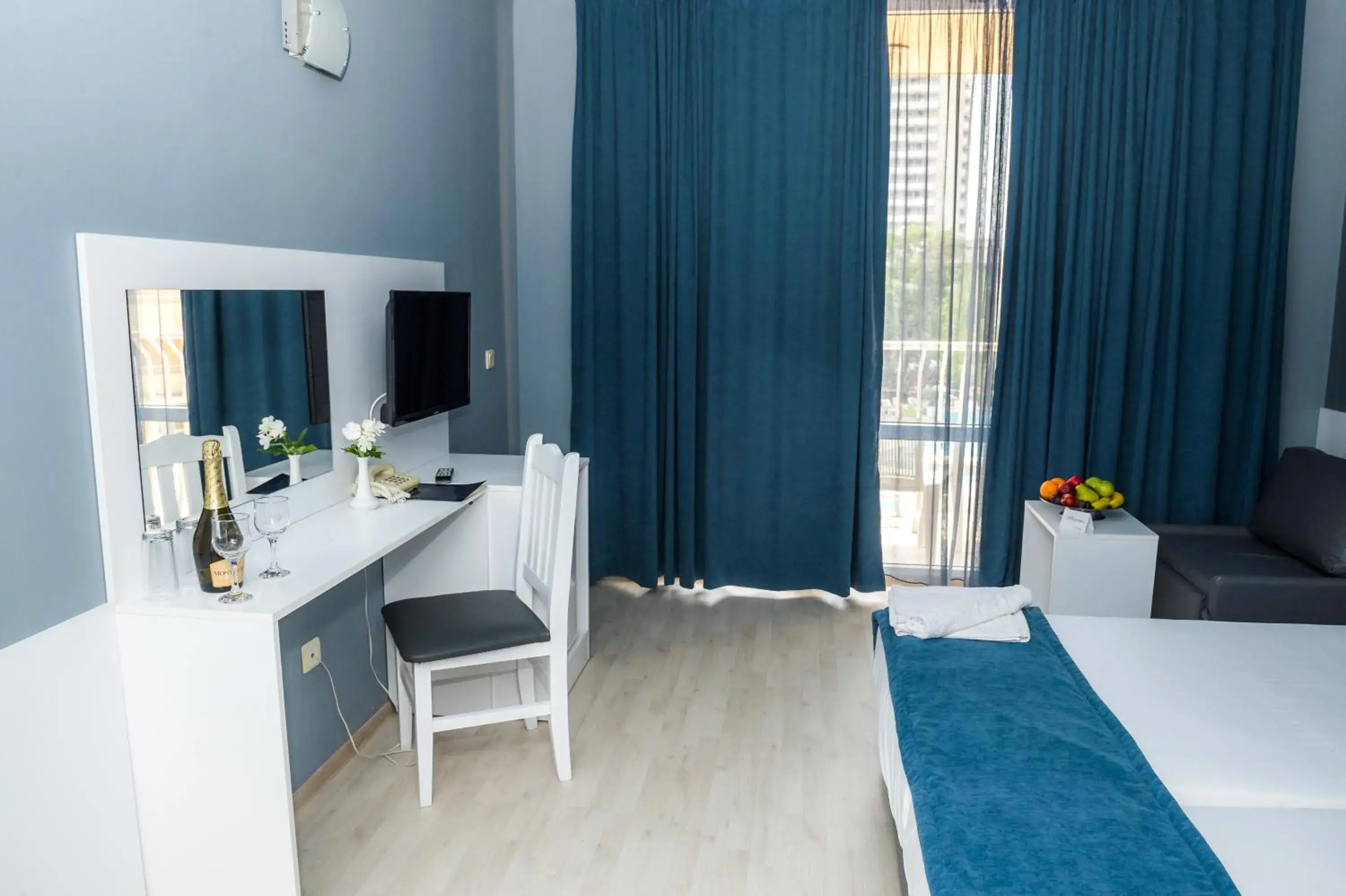 Communal lounge/ TV room, Bed in Sun Palace Hotel - All Inclusive Communal lounge/ TV room, Bed in Sun Palace Hotel - All Inclusive