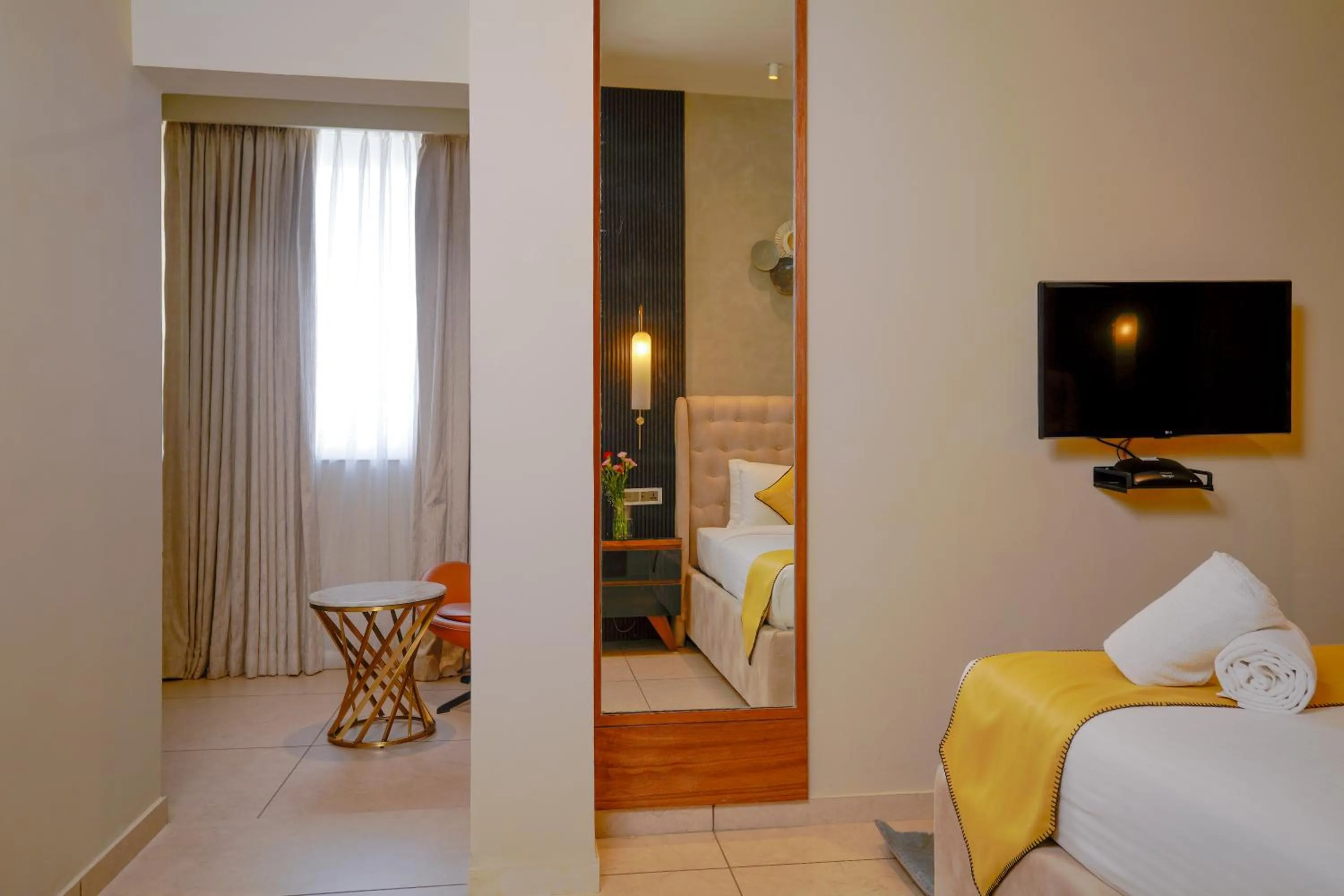 Bed in Lazdana Hotel Bangalore