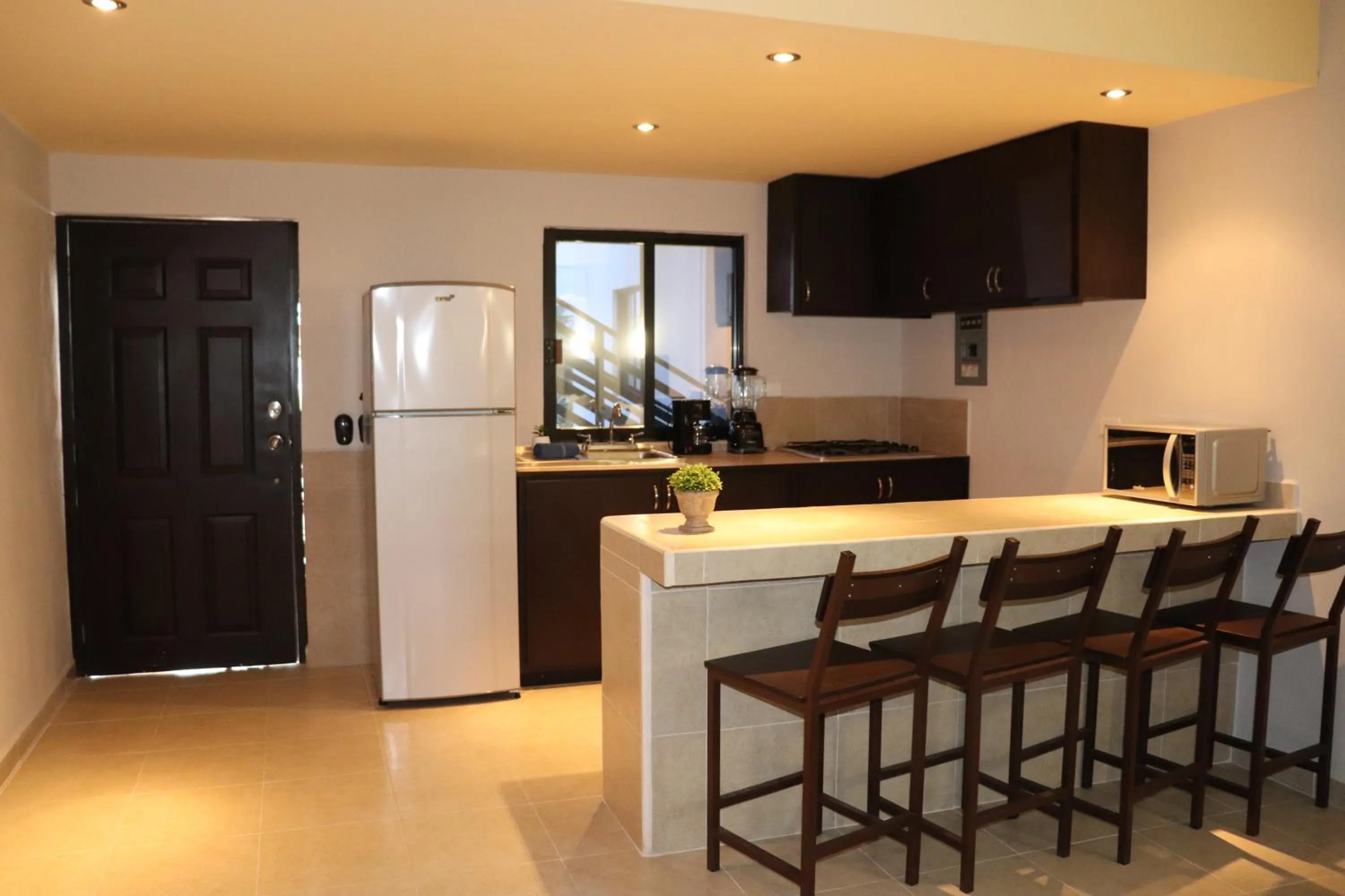 Kitchen or kitchenette in Capital O Hotel Jazuli