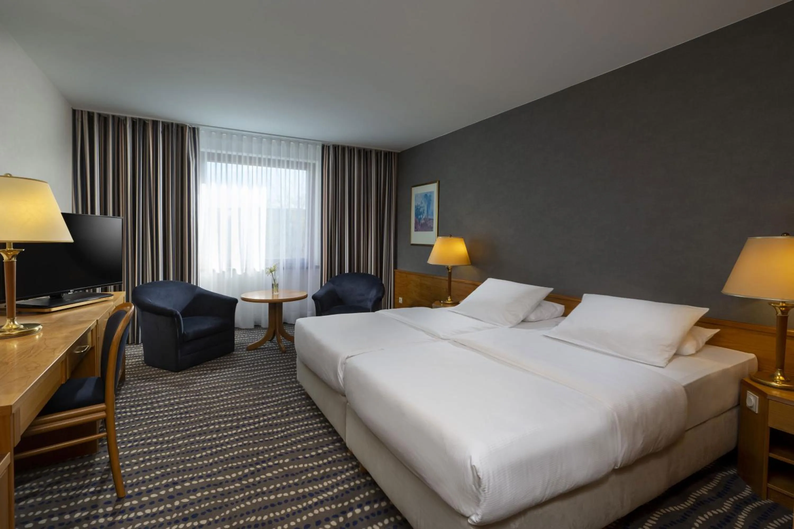Photo of the whole room, Bed in Maritim Hotel Magdeburg