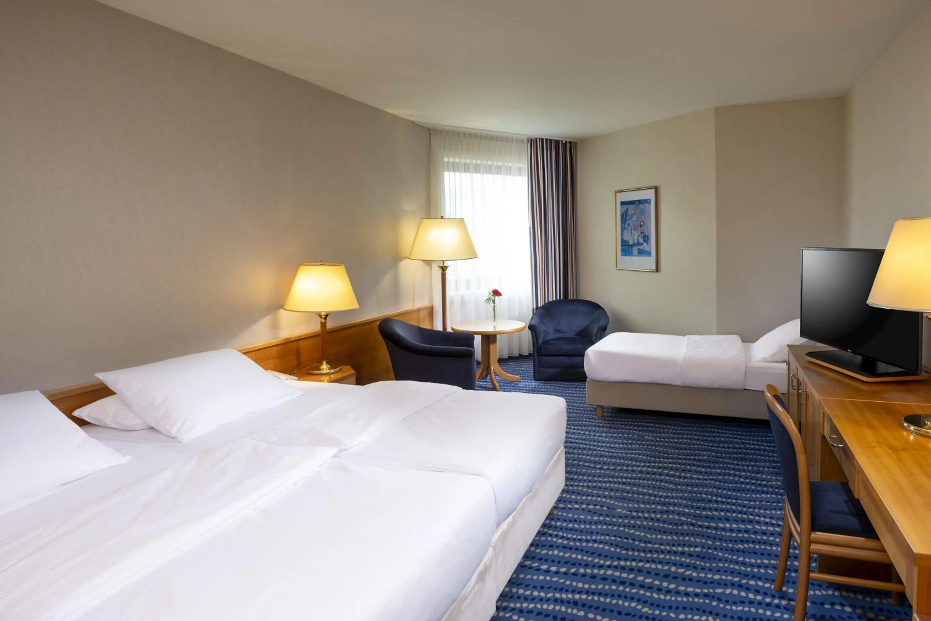 Photo of the whole room, Bed in Maritim Hotel Magdeburg