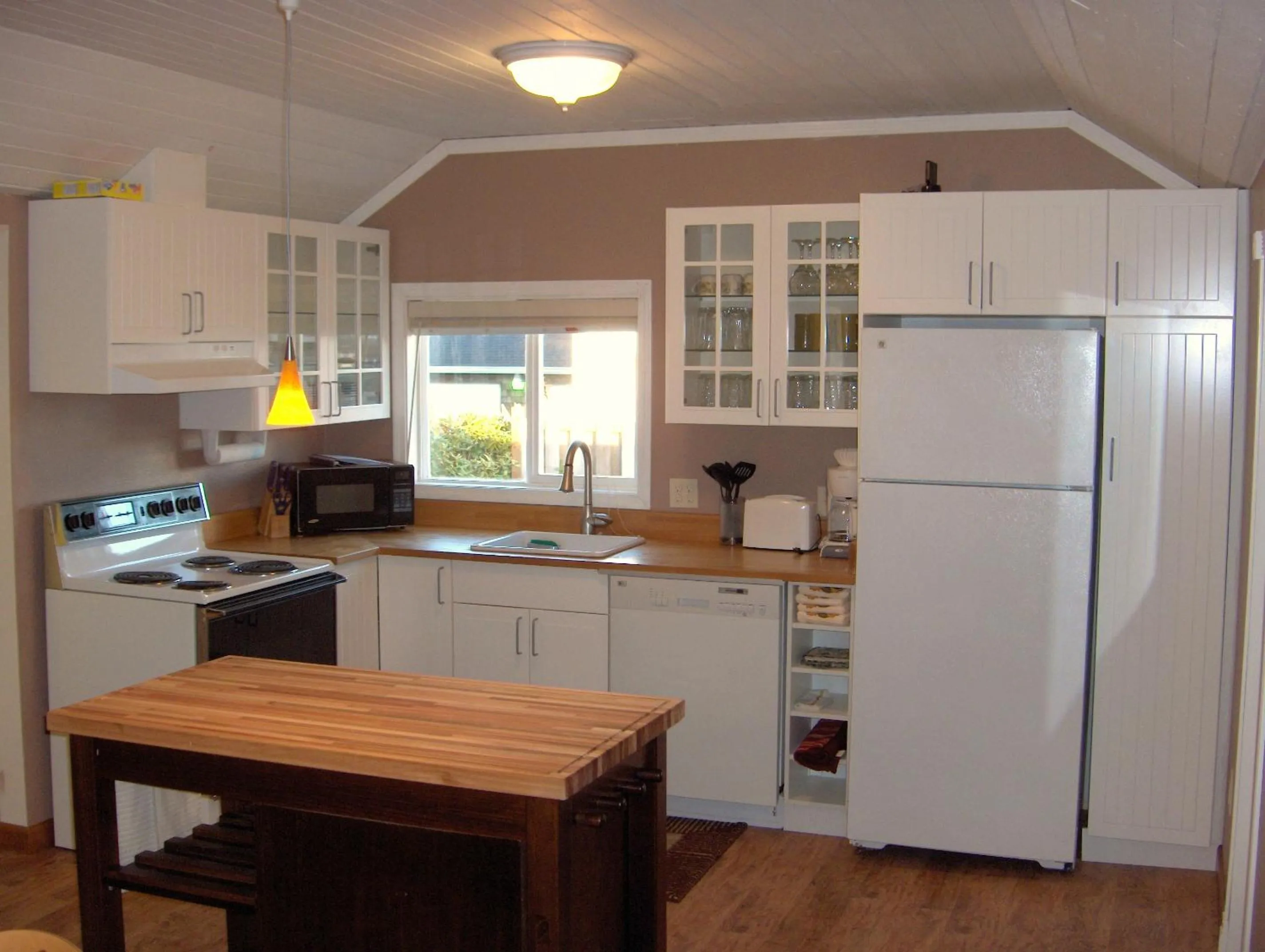 Kitchen or kitchenette in Historic 1920s Cabin