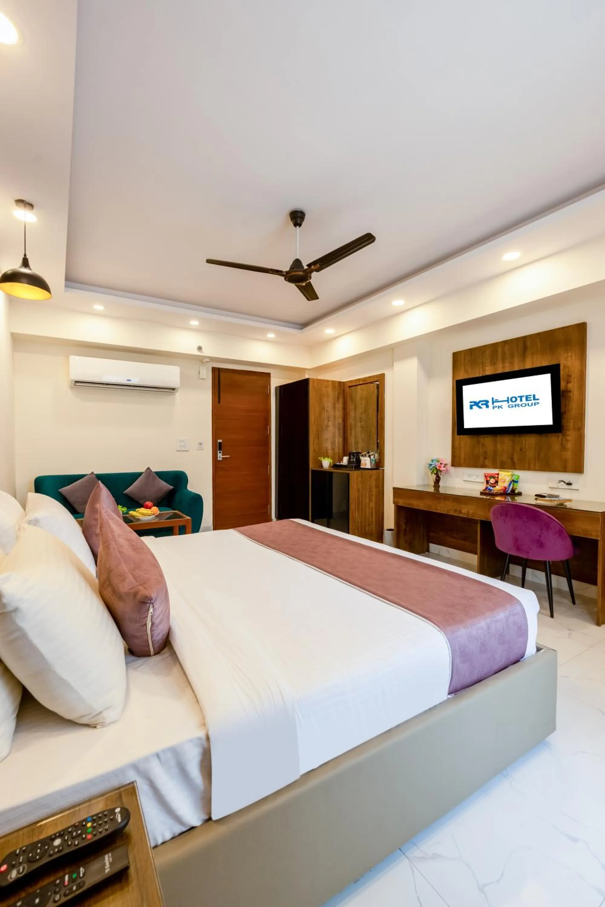 Communal lounge/ TV room, Bed in PK Boutique Hotel Noida Expressway