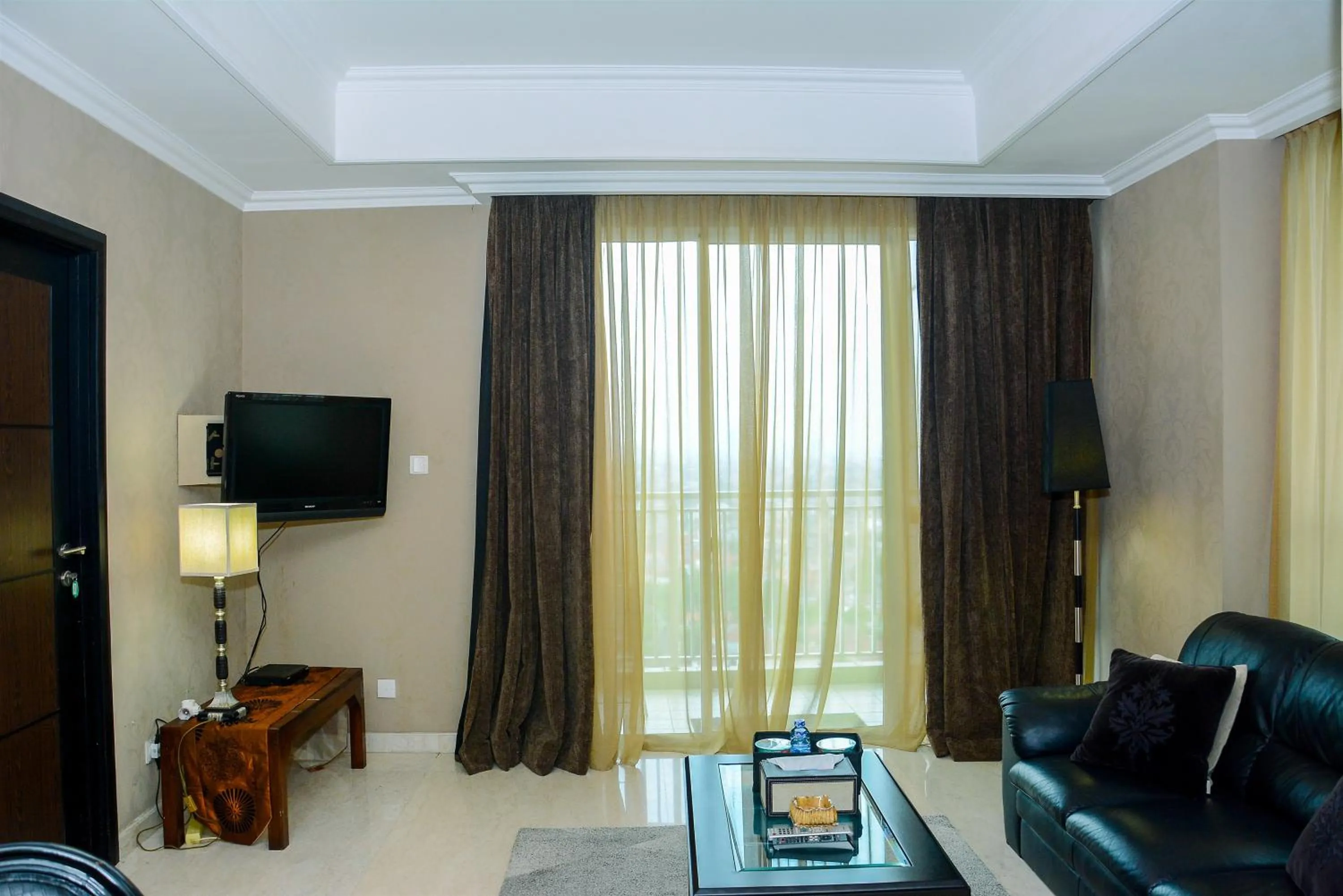 Living room in Modern and Luxurious 2BR Essence Dharmawangsa Apartment By Travelio