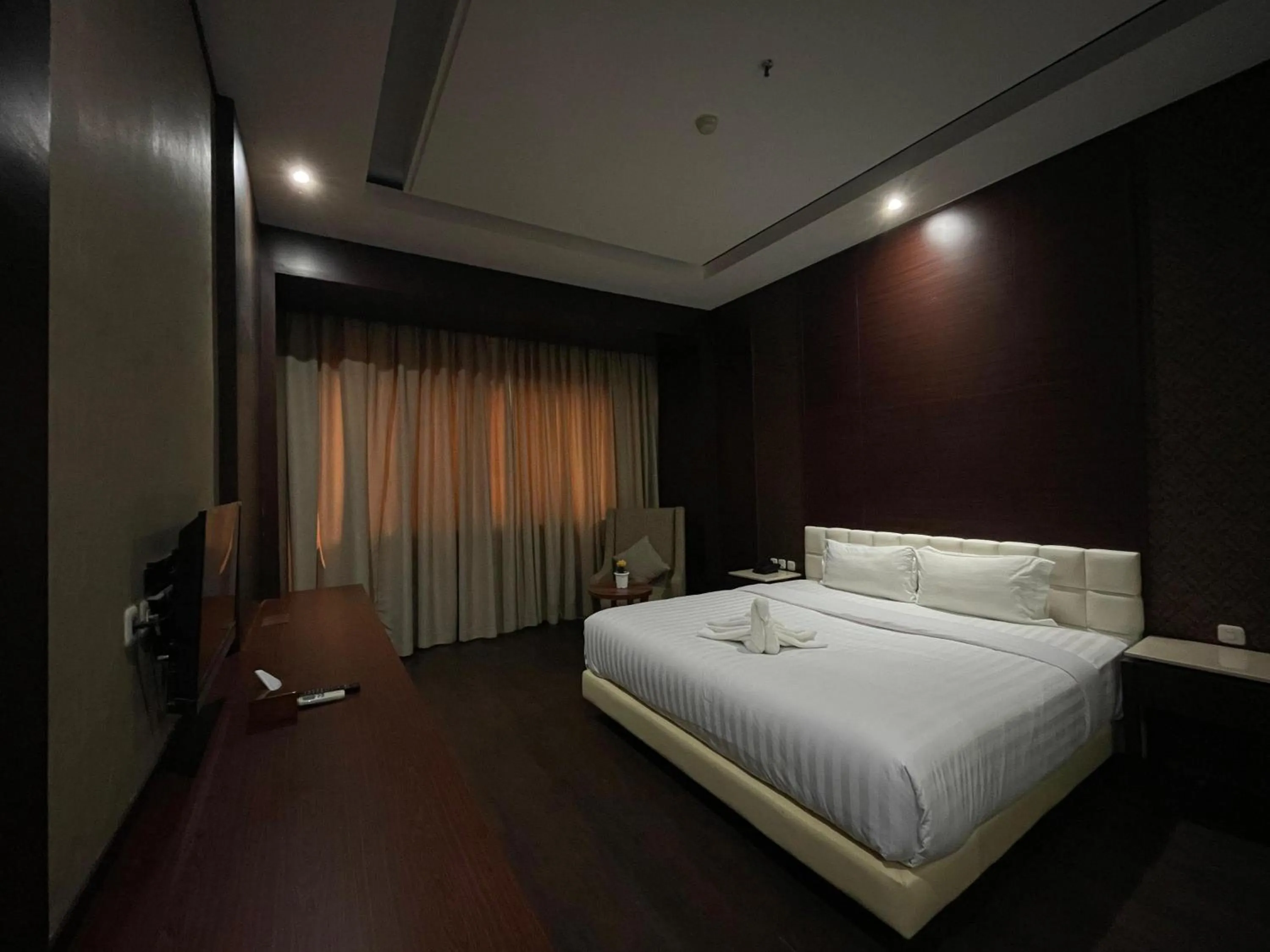 Bed in Grand Arjuna Hotel