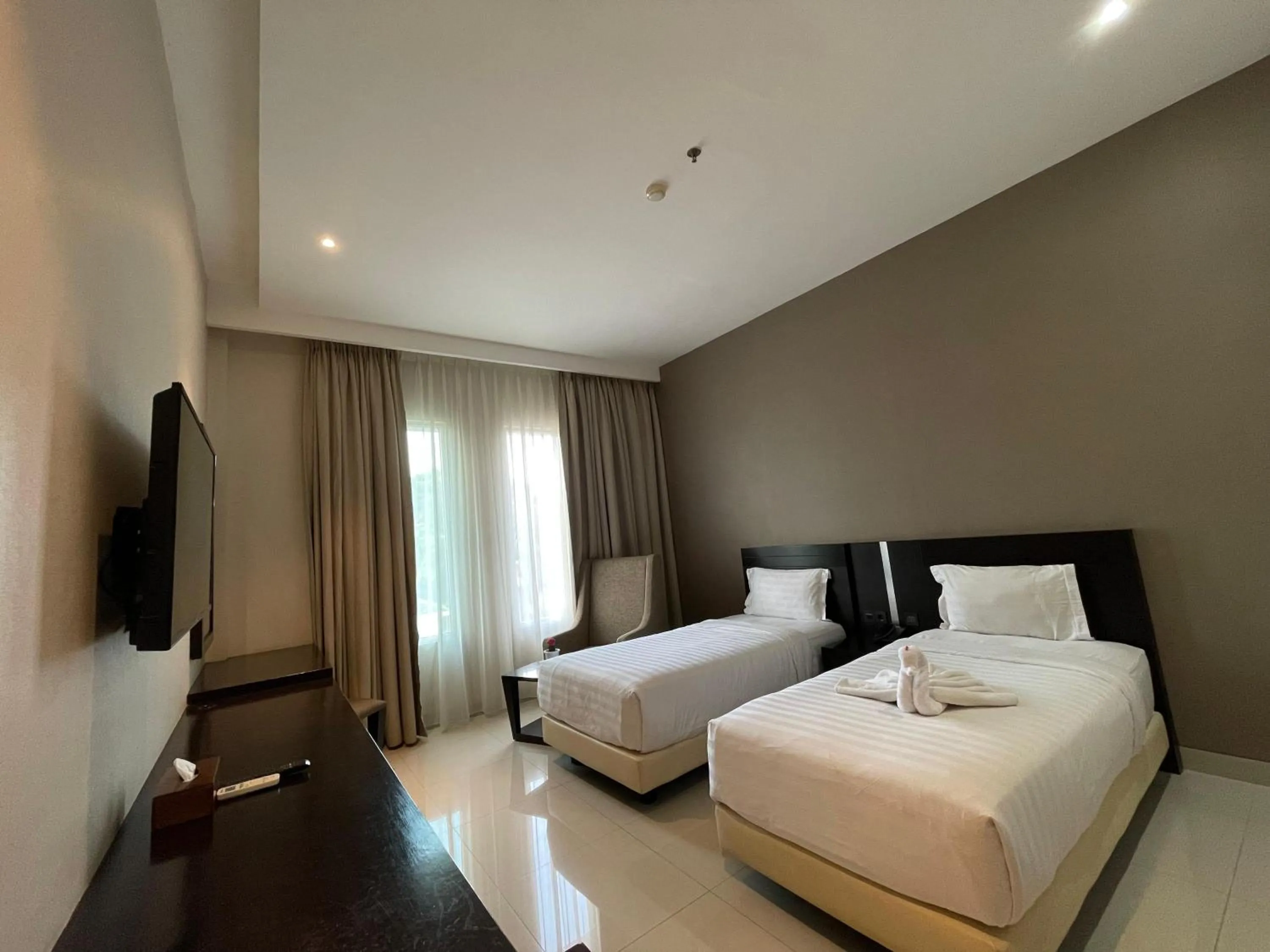 Bed in Grand Arjuna Hotel