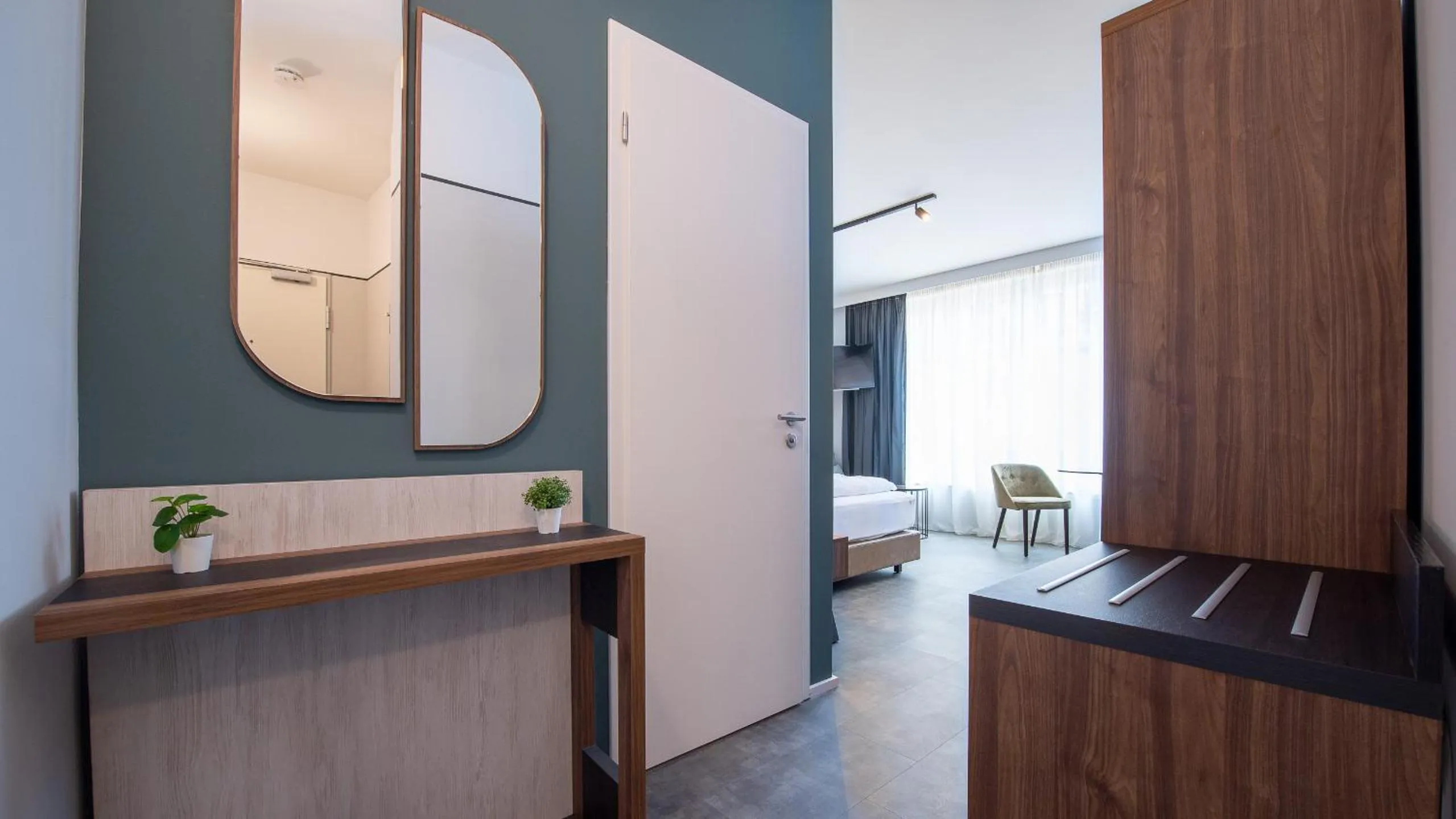 wardrobe in Metropol Apartments & Suites