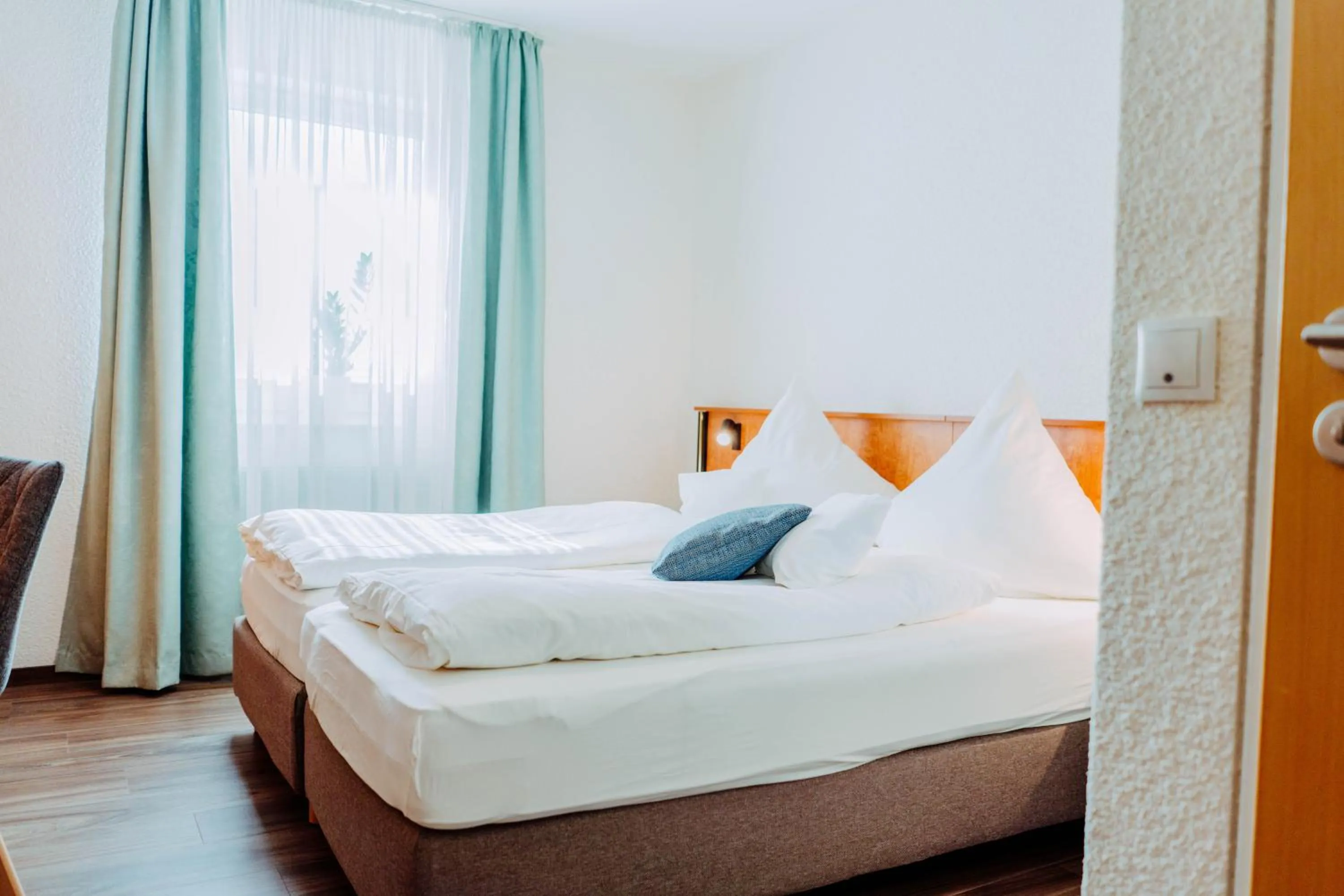 Bed in Garni-Hotel Goldenes Lamm