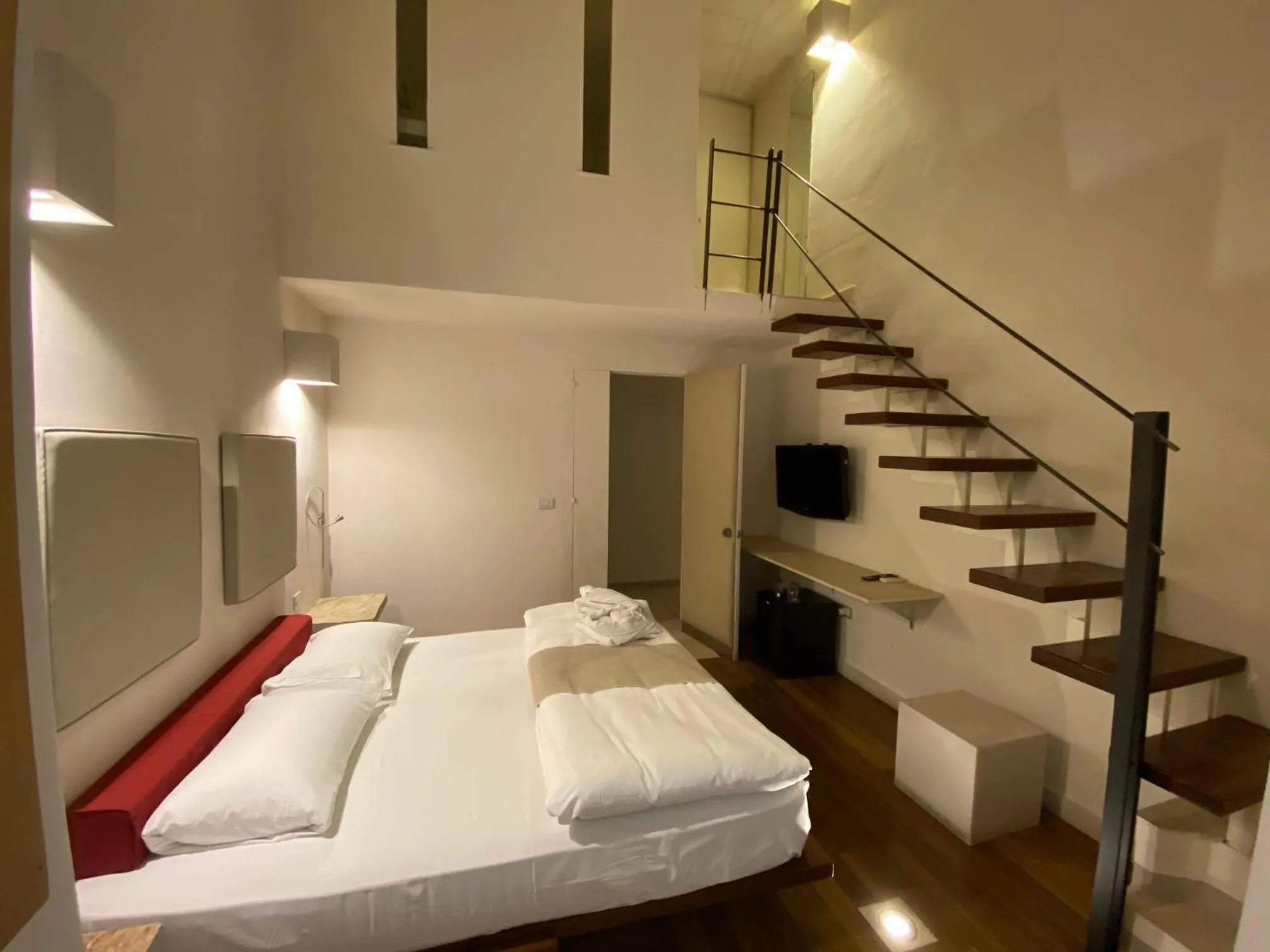 Bed in Micalò Art Rooms