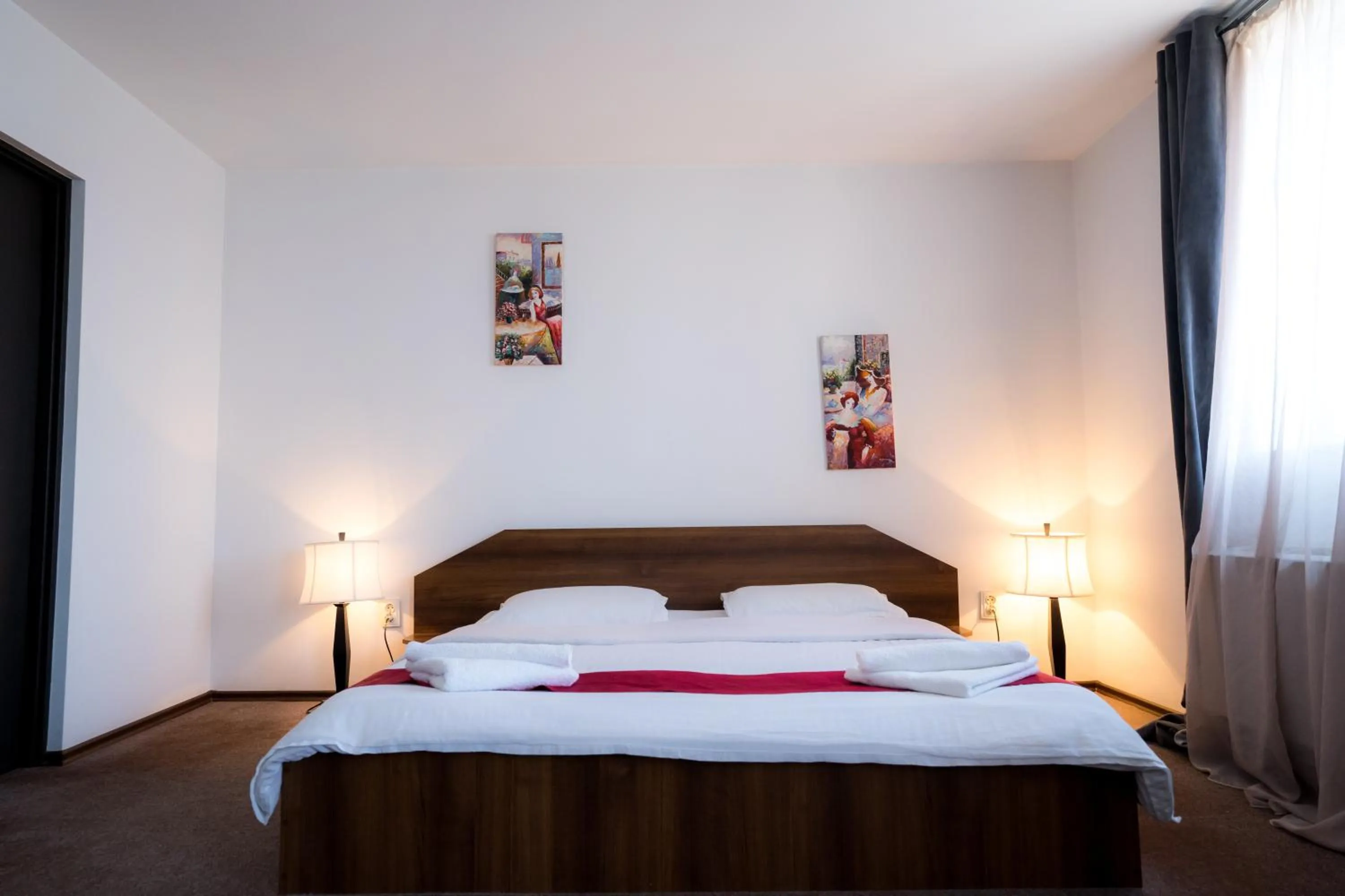 Bed in Pensiunea Dacia Deva