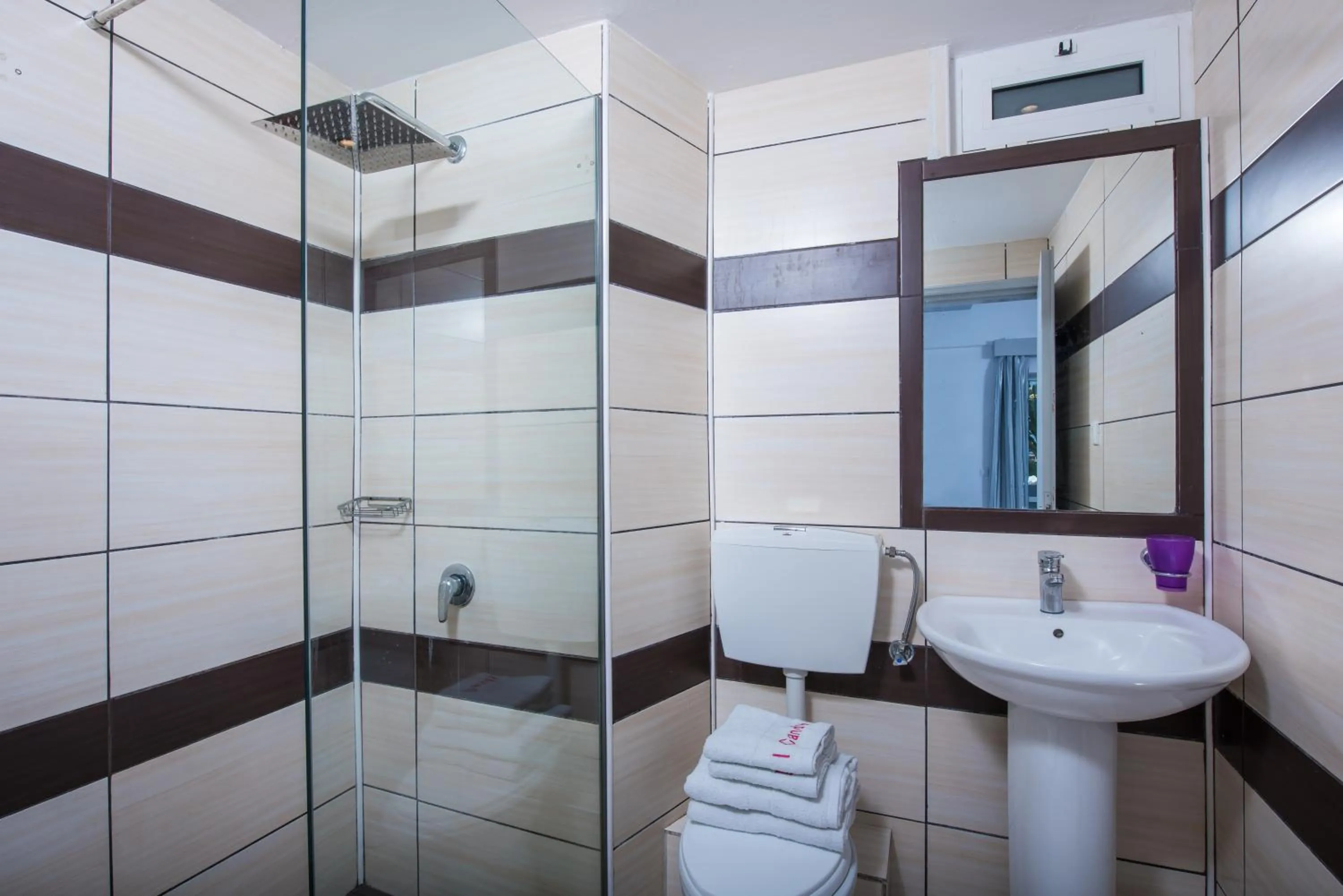 Bathroom in I Candy Malia by Estia