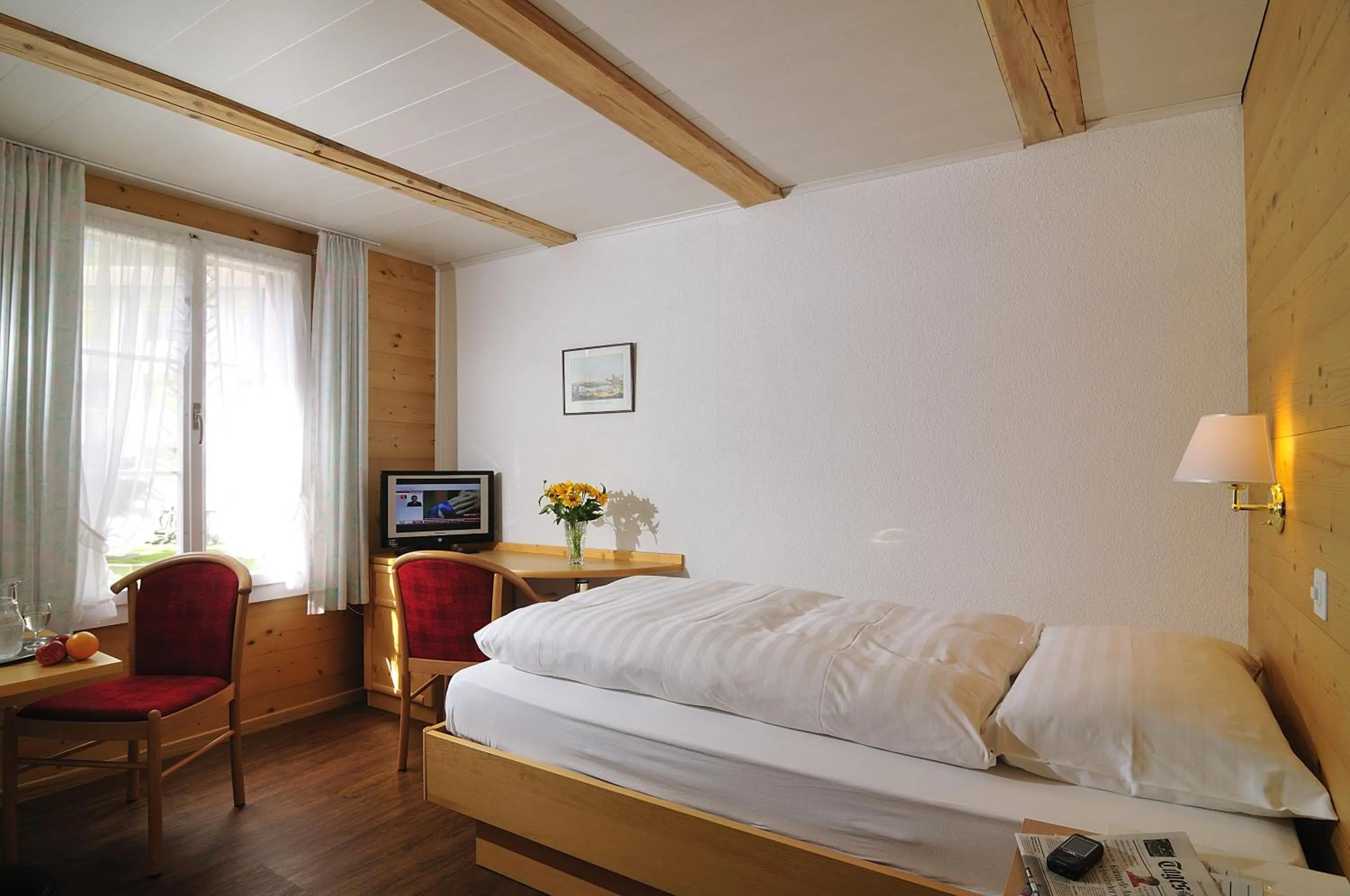 Photo of the whole room, Bed in Hotel Chalet Swiss