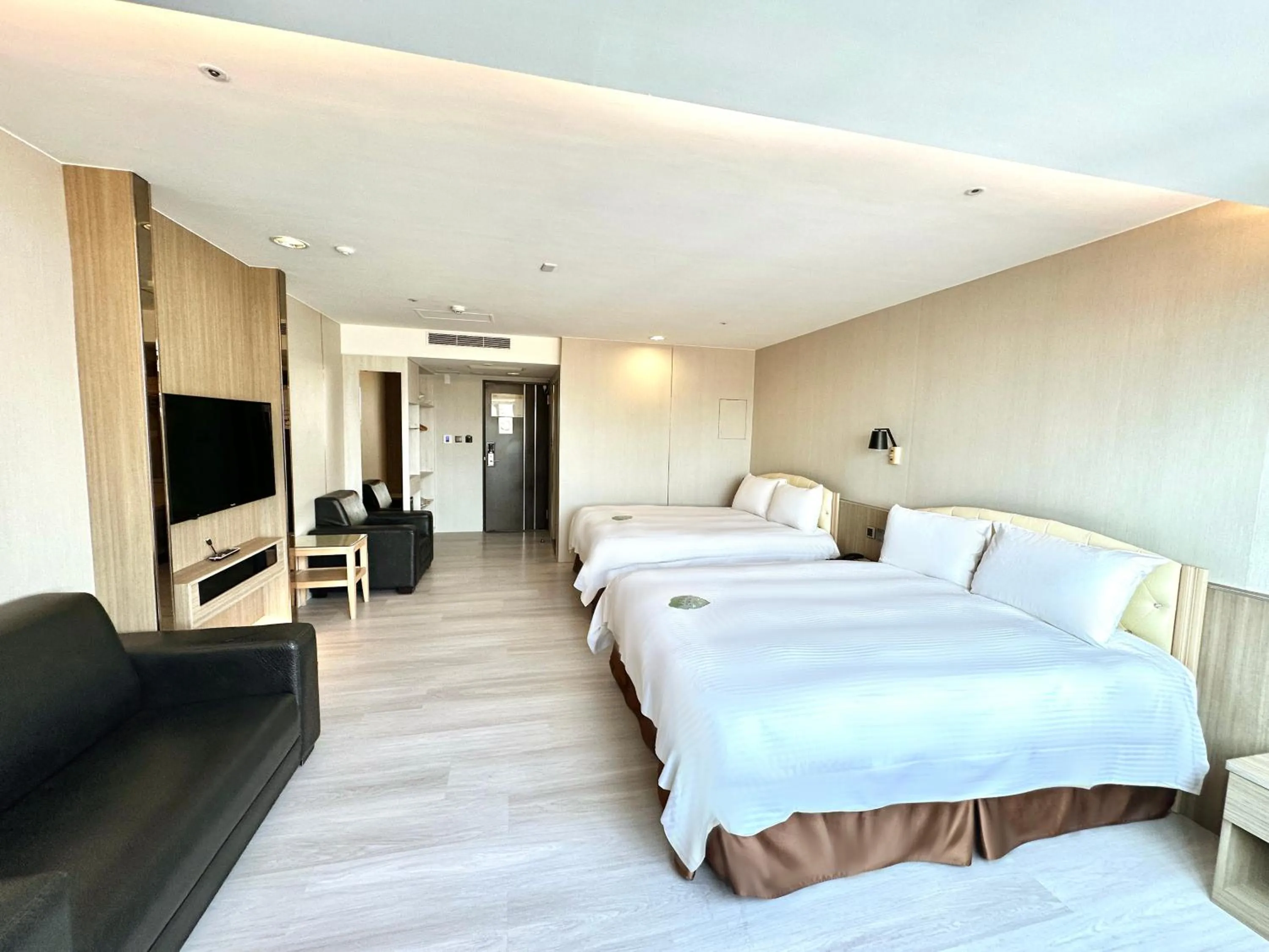 Bed in Grand Earl Hotel