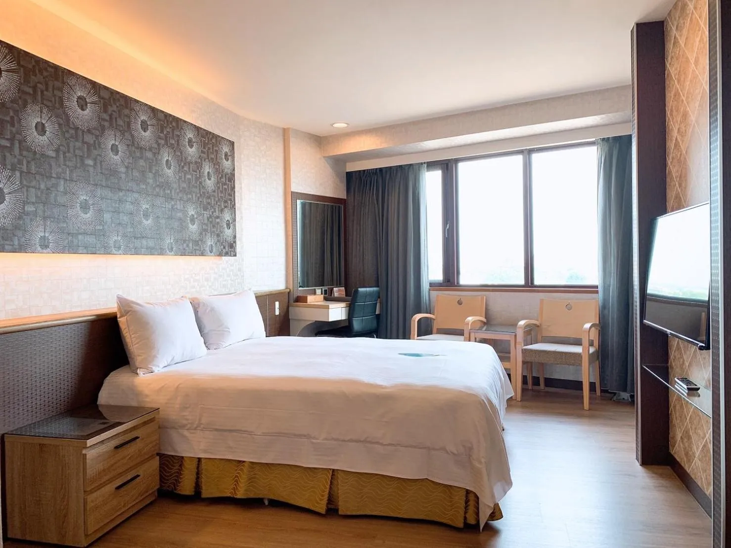 Bed in Grand Earl Hotel