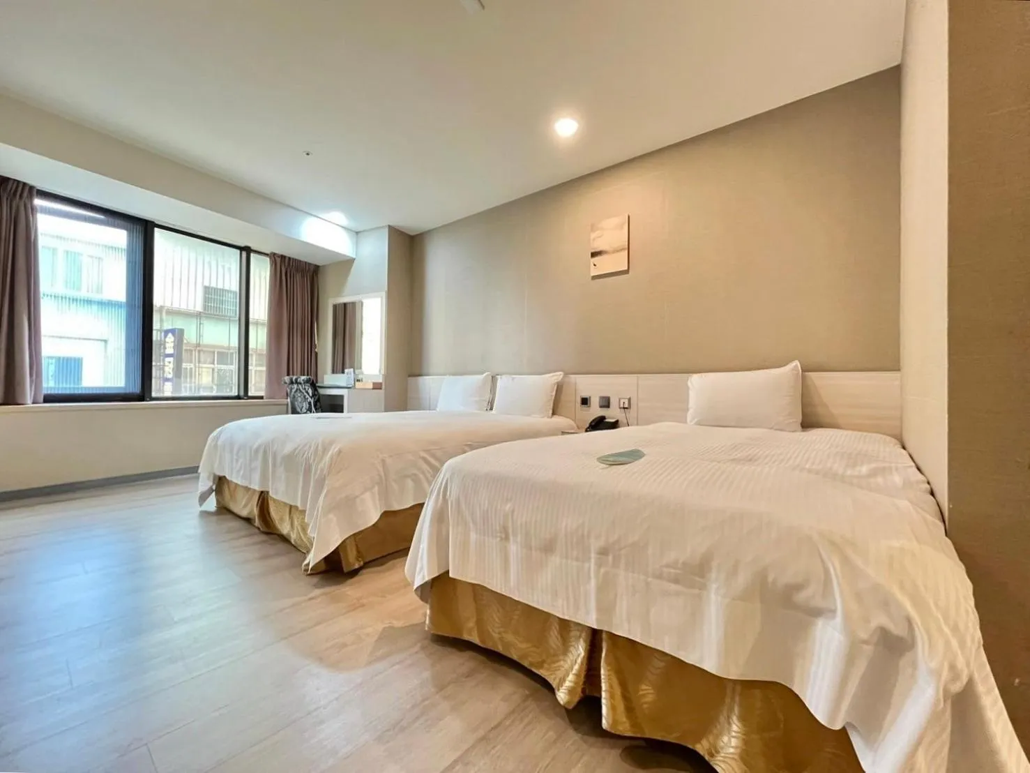 Bed in Grand Earl Hotel