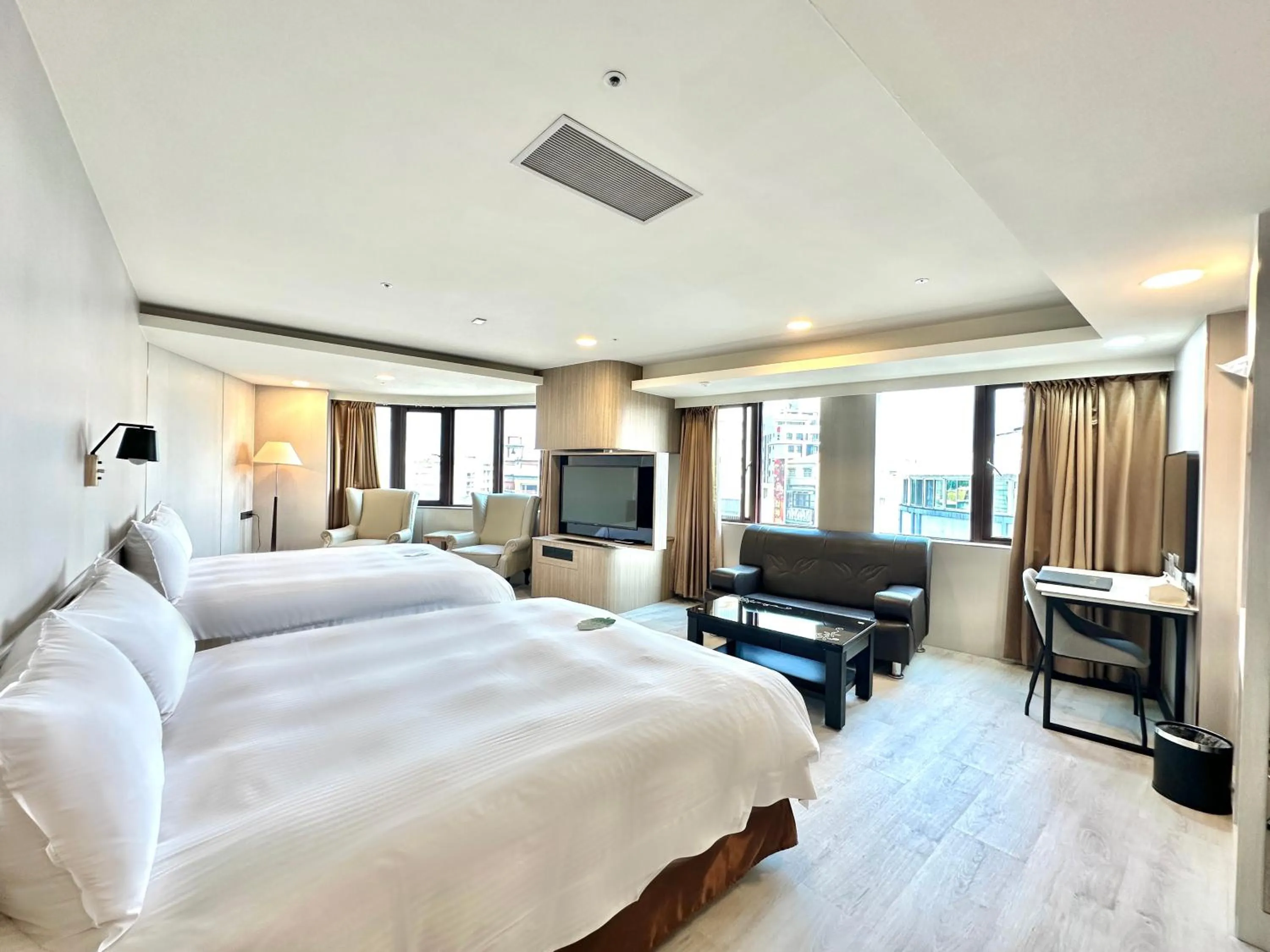 Bed in Grand Earl Hotel