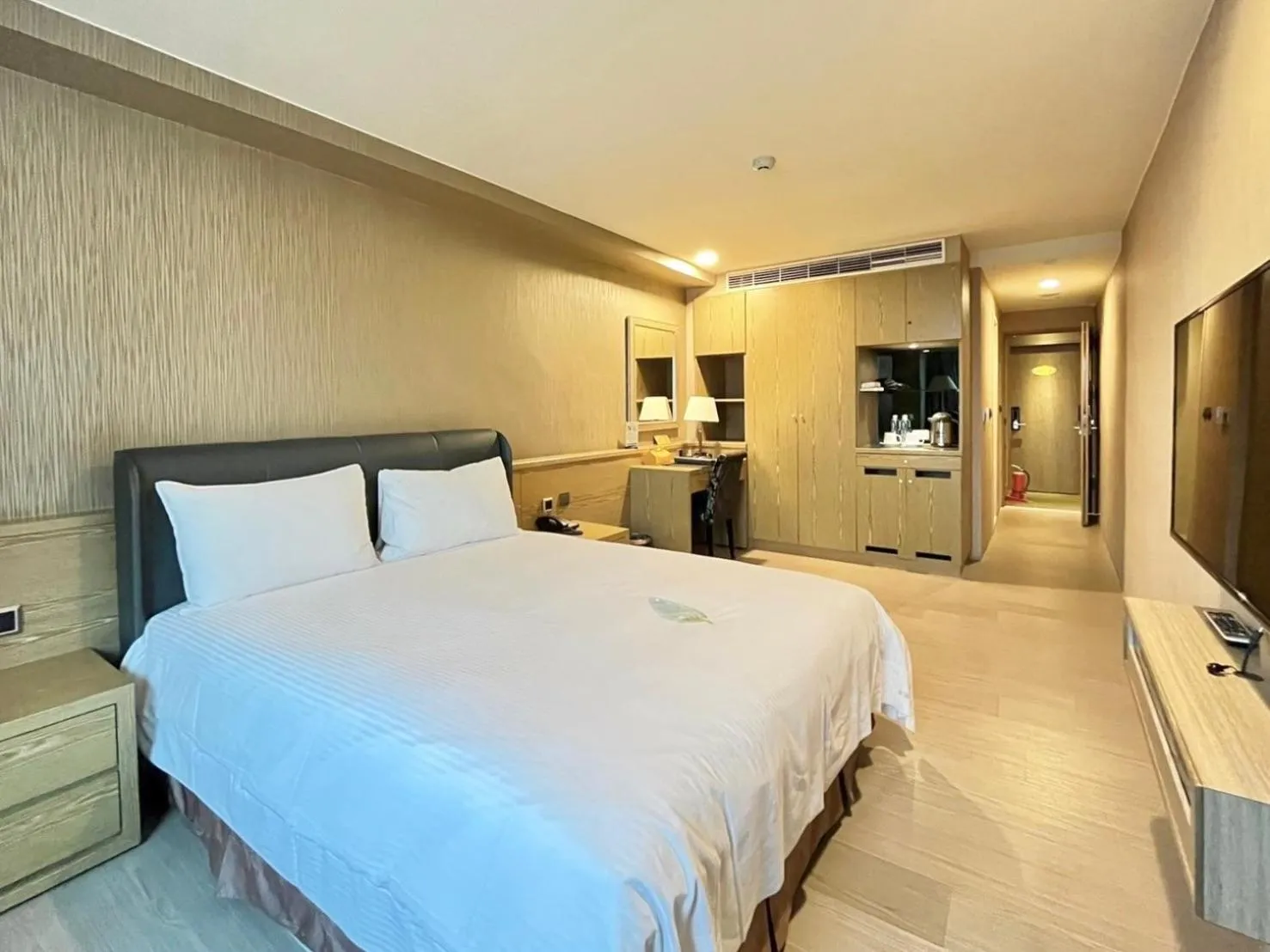 Bed in Grand Earl Hotel