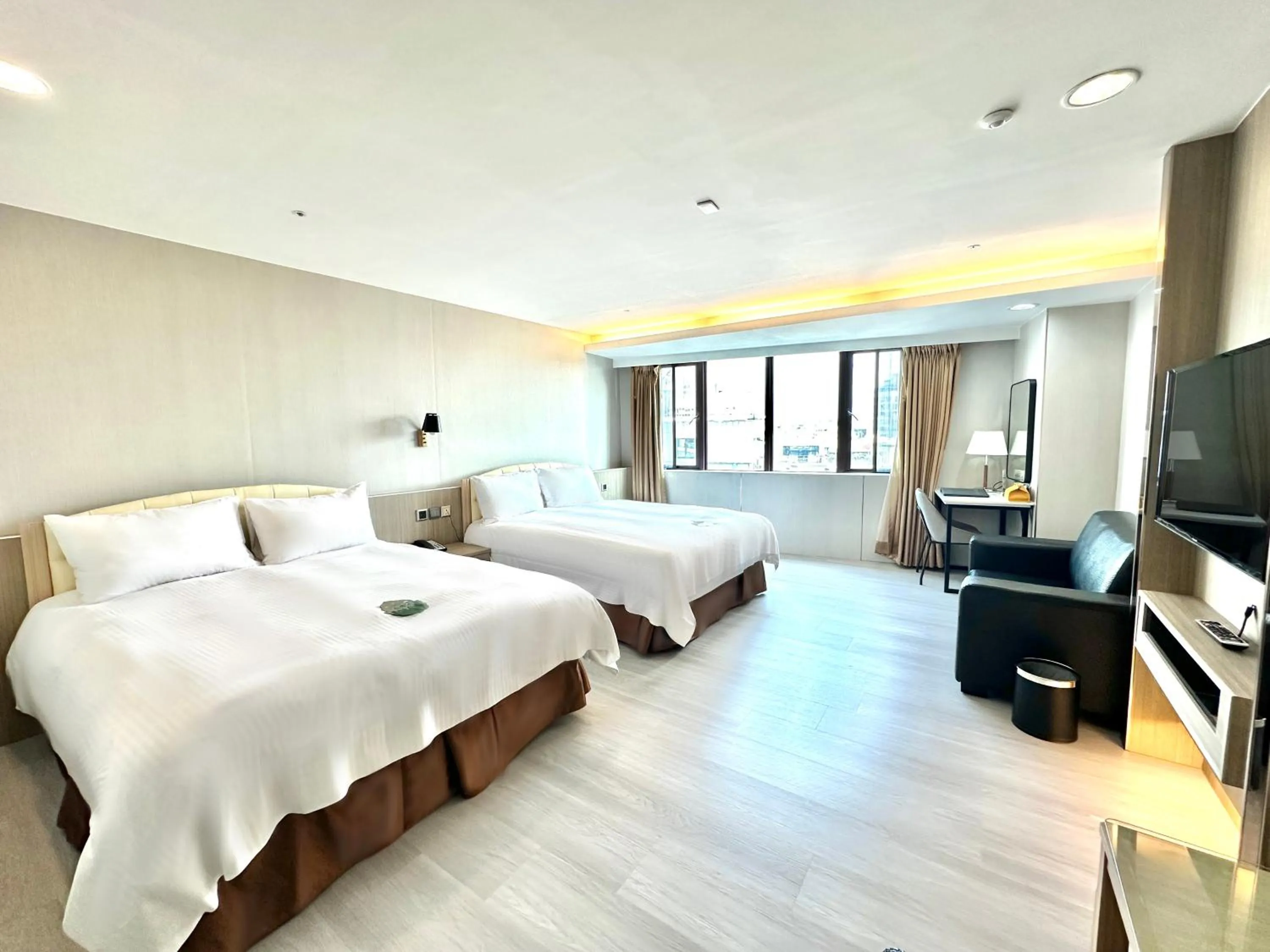 Bed in Grand Earl Hotel