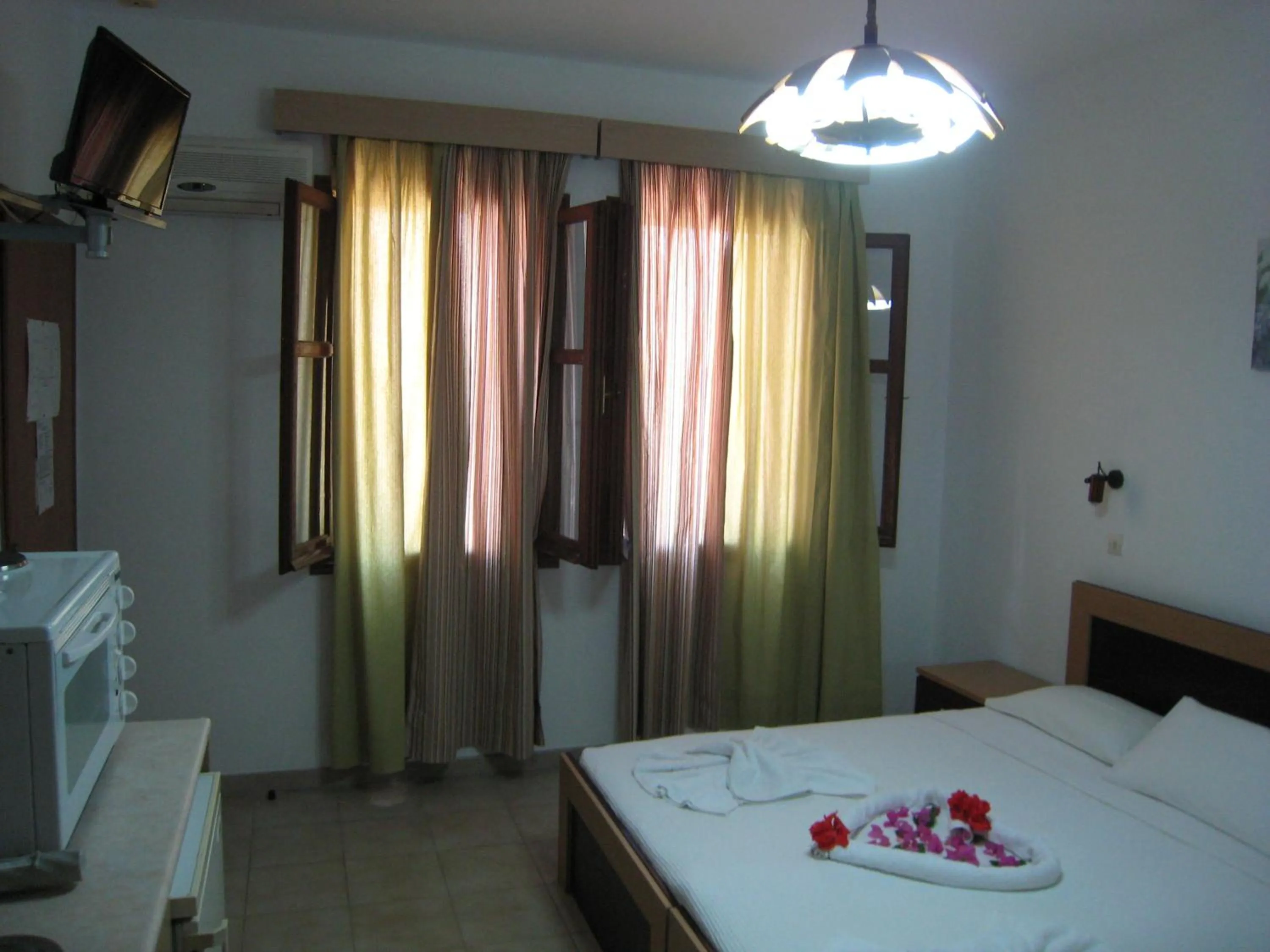 Bed in Eleftheria Lindian Studios II