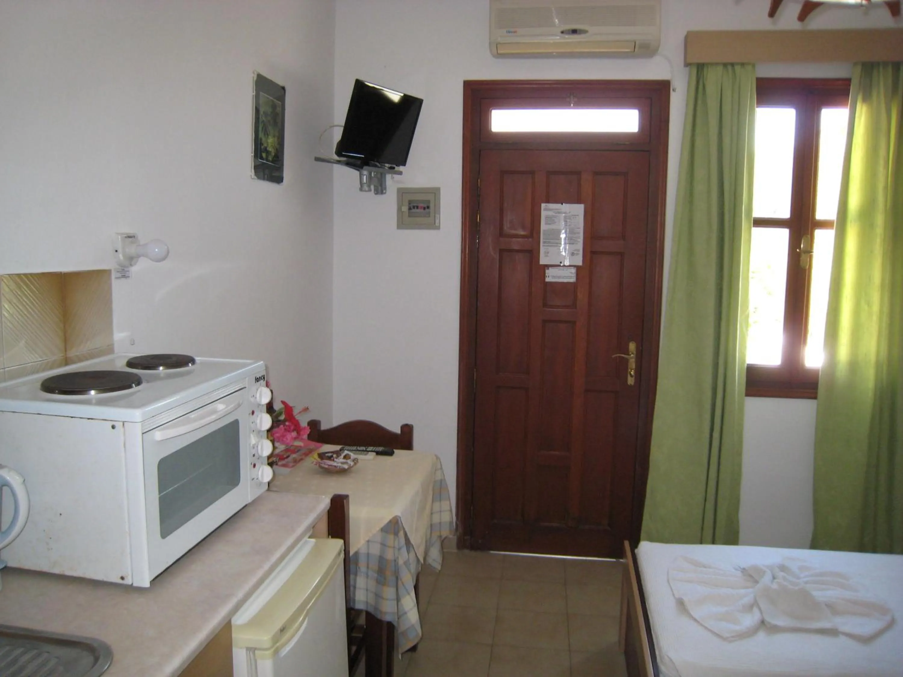 Bed in Eleftheria Lindian Studios II