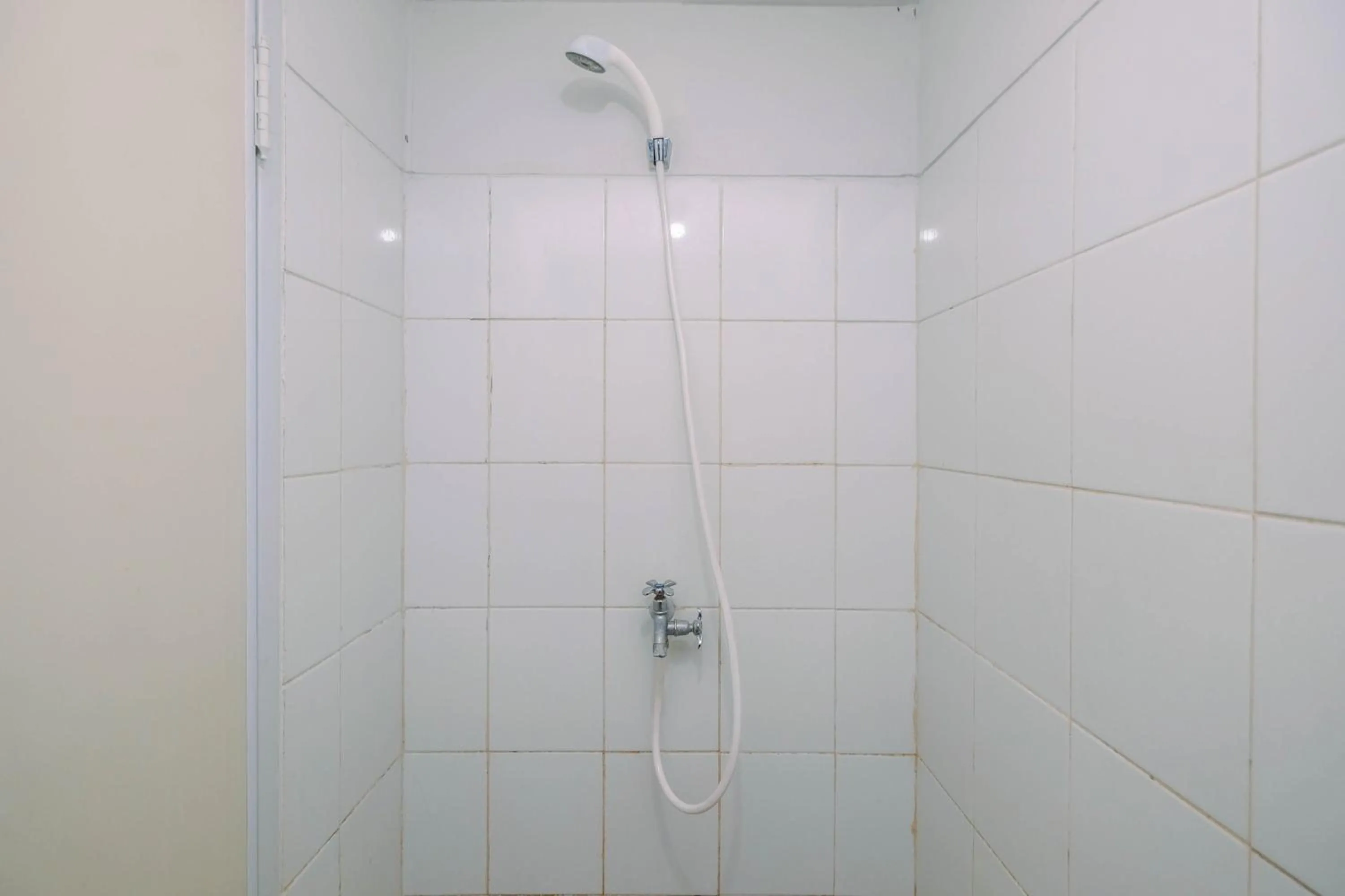 Bathroom in Comfortable and Homey Studio Apartment at Dramaga Tower near IPB By Travelio