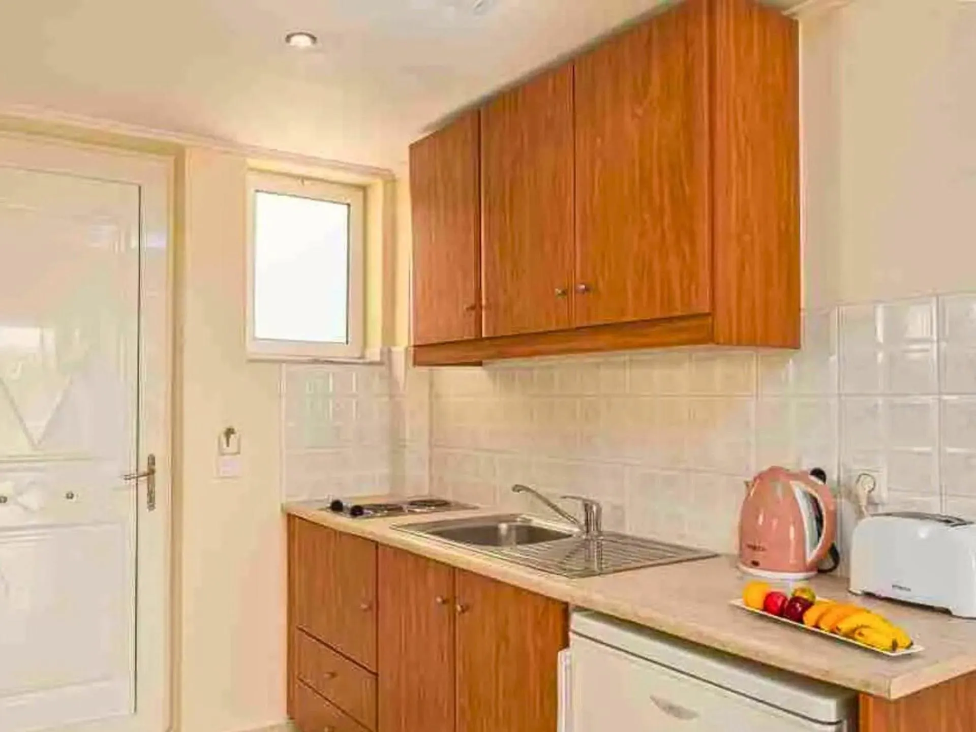 Kitchen or kitchenette in Manousis ApartHotel