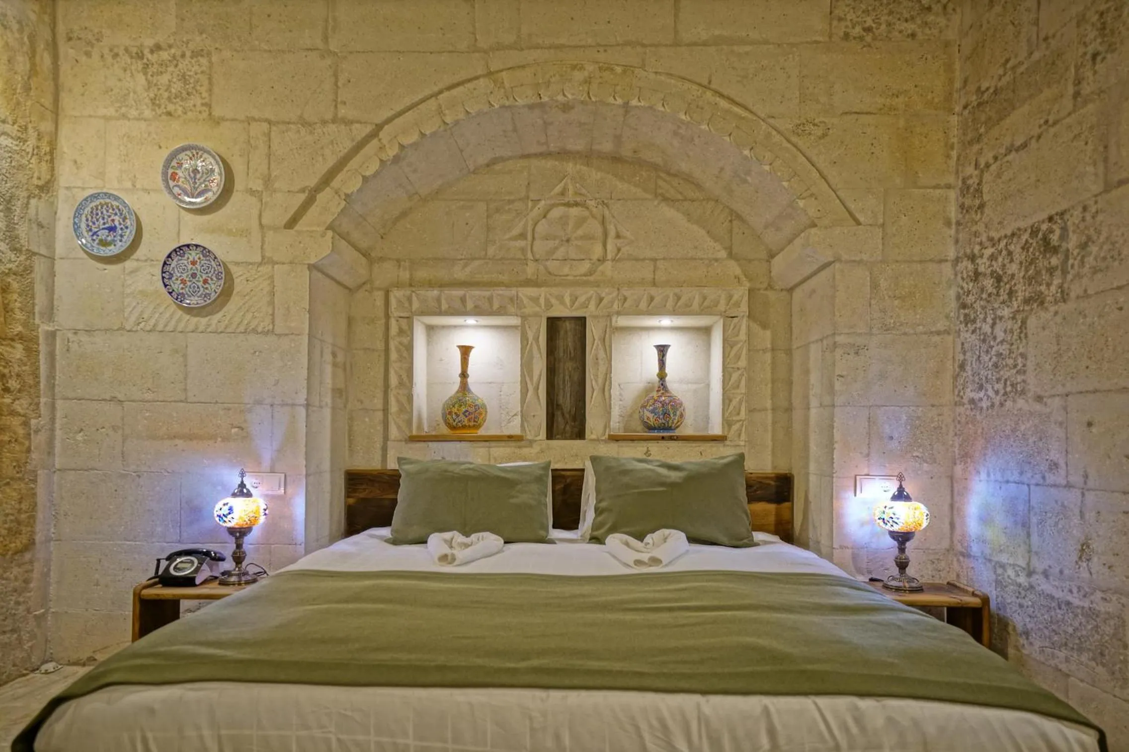 Bed in Vigneron Cave Hotel