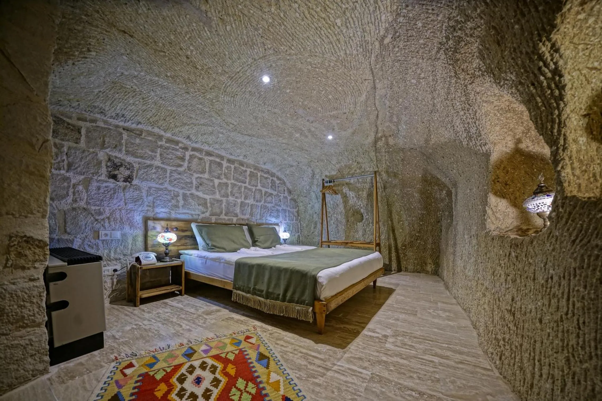 Bed in Vigneron Cave Hotel